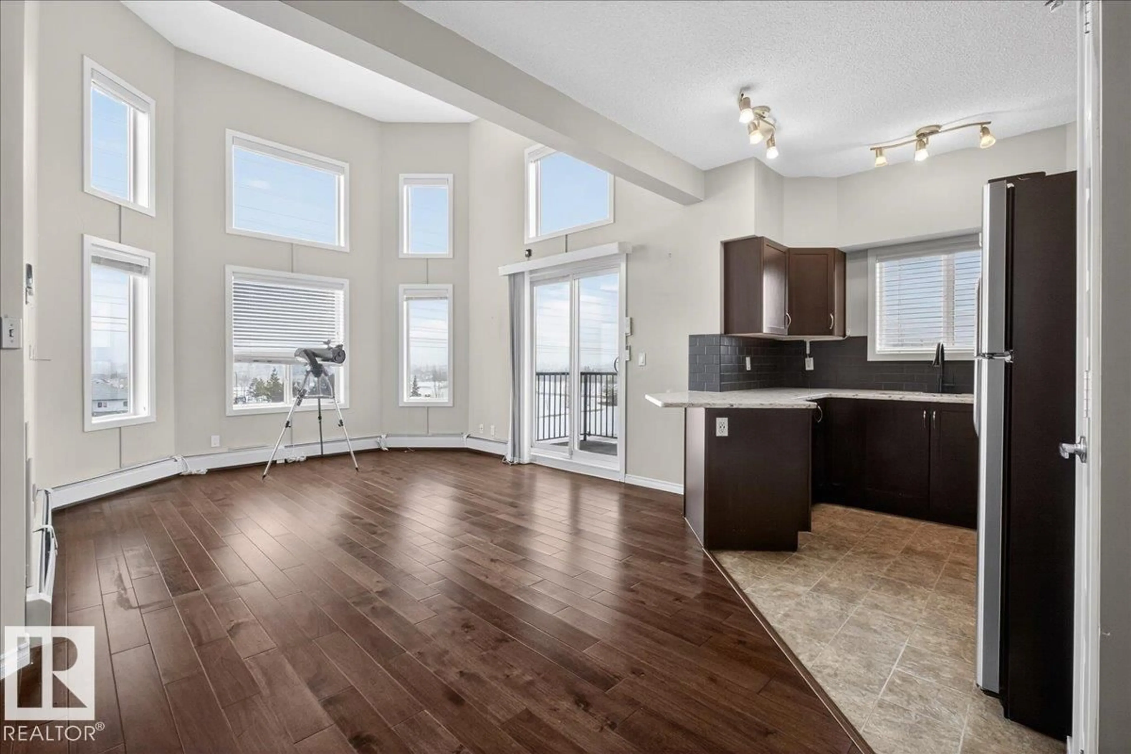 Open concept kitchen, wood/laminate floor for #418 - 400 SILVER BERRY RD, Edmonton Alberta T6T0H1