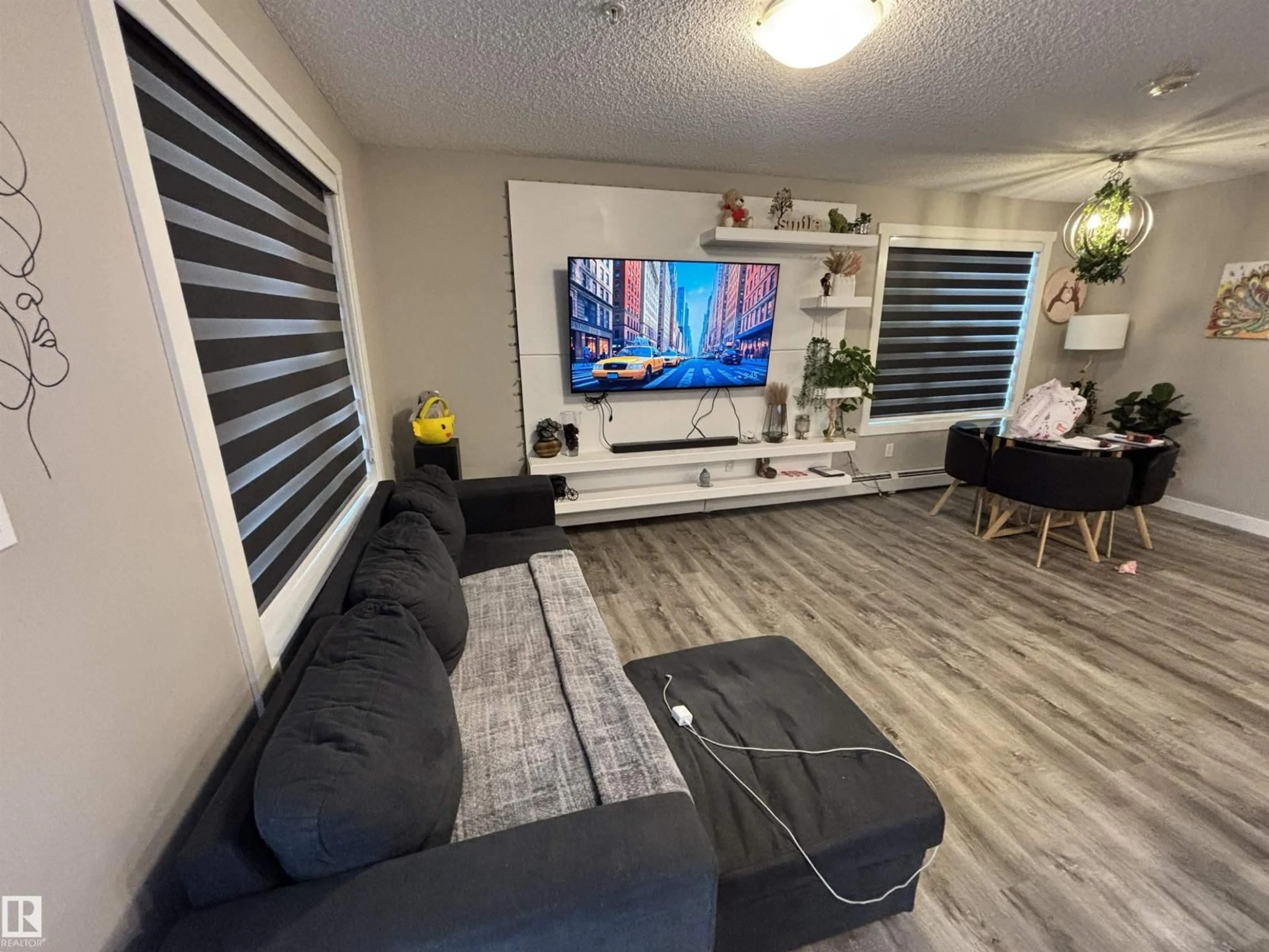 Living room with furniture, unknown for 103 - 1503 TAMARACK BV, Edmonton Alberta T6T2J5