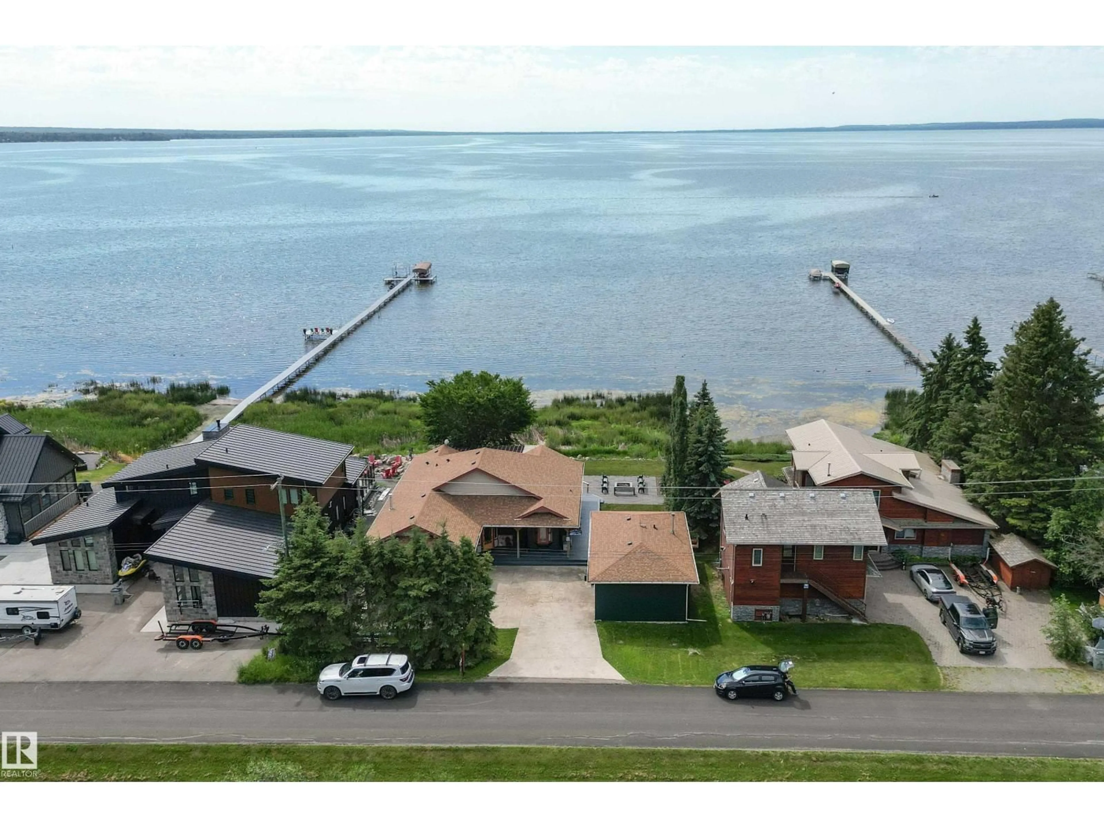 A pic from outside/outdoor area/front of a property/back of a property/a pic from drone, water/lake/river/ocean view for 103 ARGENTIA BEACH, Rural Wetaskiwin County Alberta T0C2C0