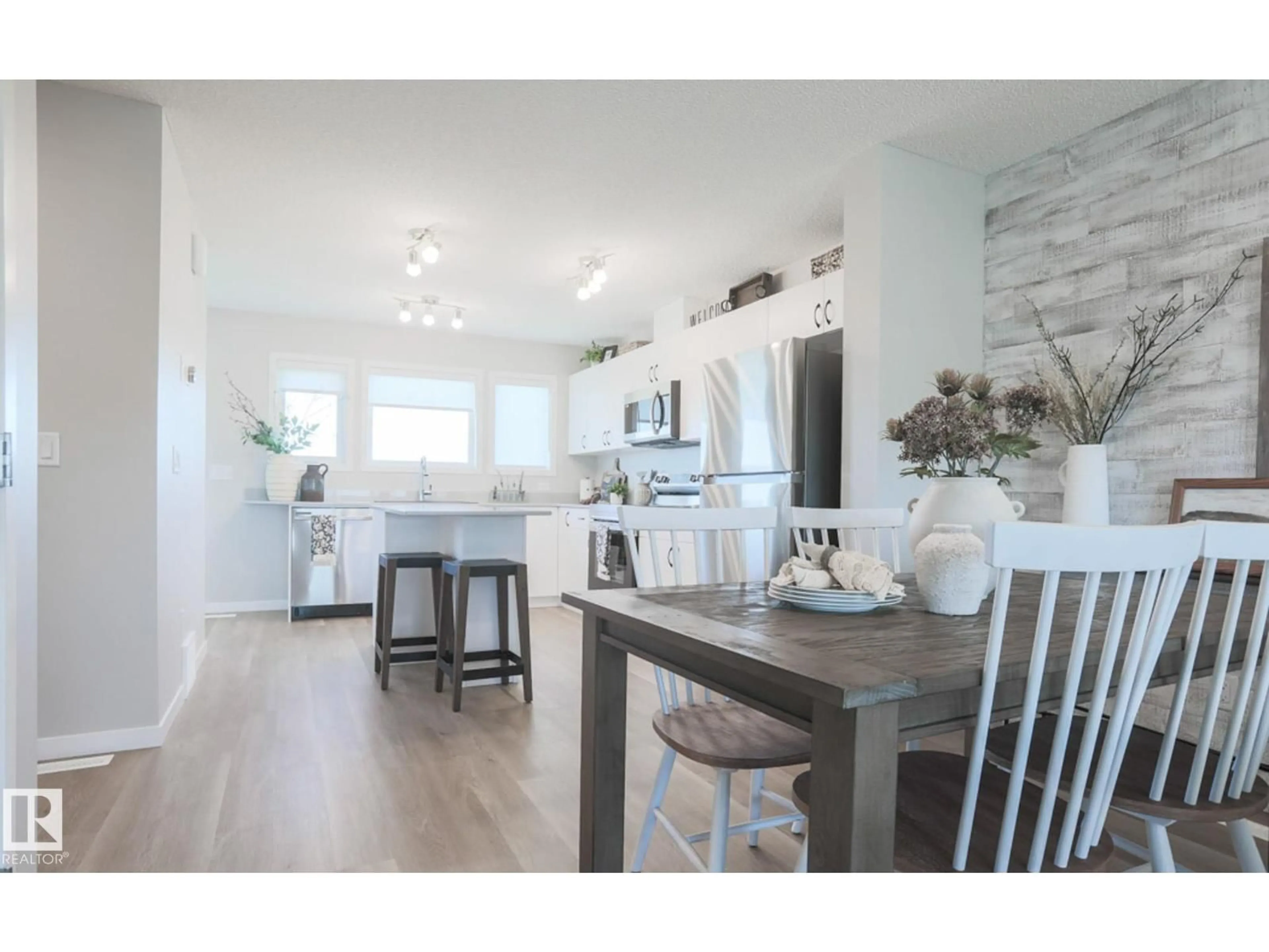 Open concept kitchen, wood/laminate floor for 143 SERENO LN, Fort Saskatchewan Alberta T8L0Z9