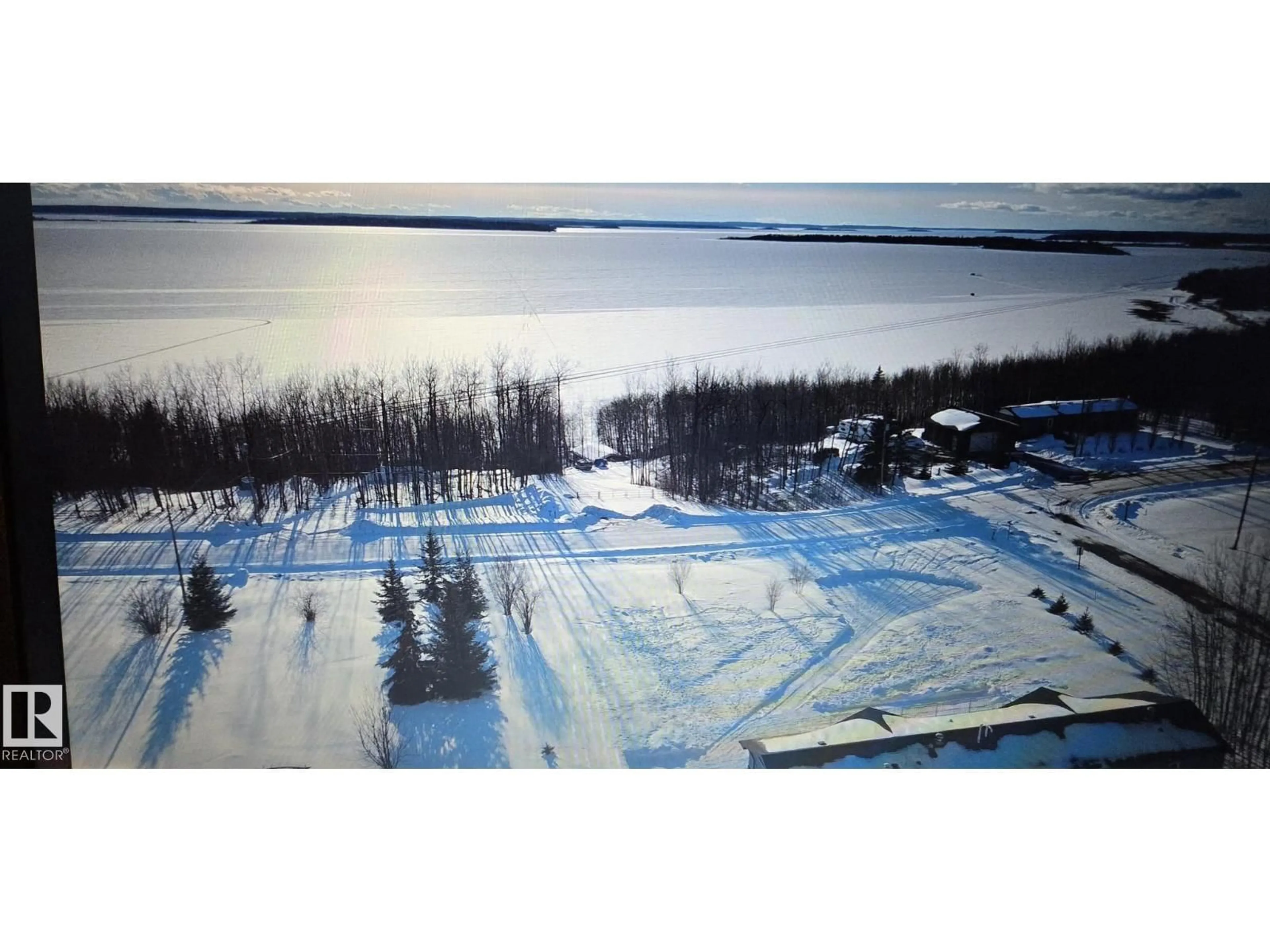 A pic from outside/outdoor area/front of a property/back of a property/a pic from drone, water/lake/river/ocean view for 529 - 13221 TWP RD 680, Rural Lac La Biche County Alberta T0A2C1