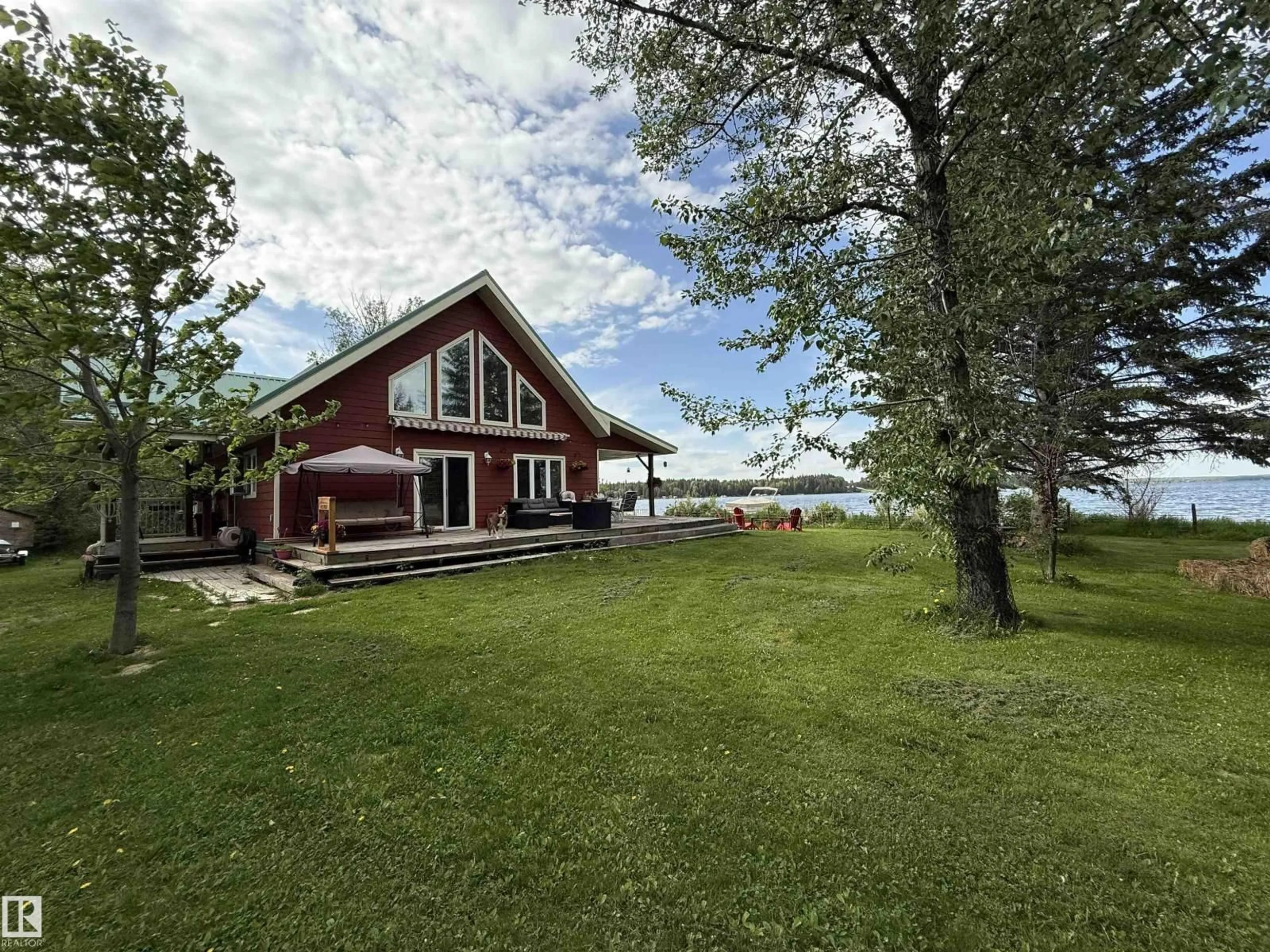 A pic from outside/outdoor area/front of a property/back of a property/a pic from drone, water/lake/river/ocean view for 210 LAKESHORE DR, Rural Wetaskiwin County Alberta T0C0T0