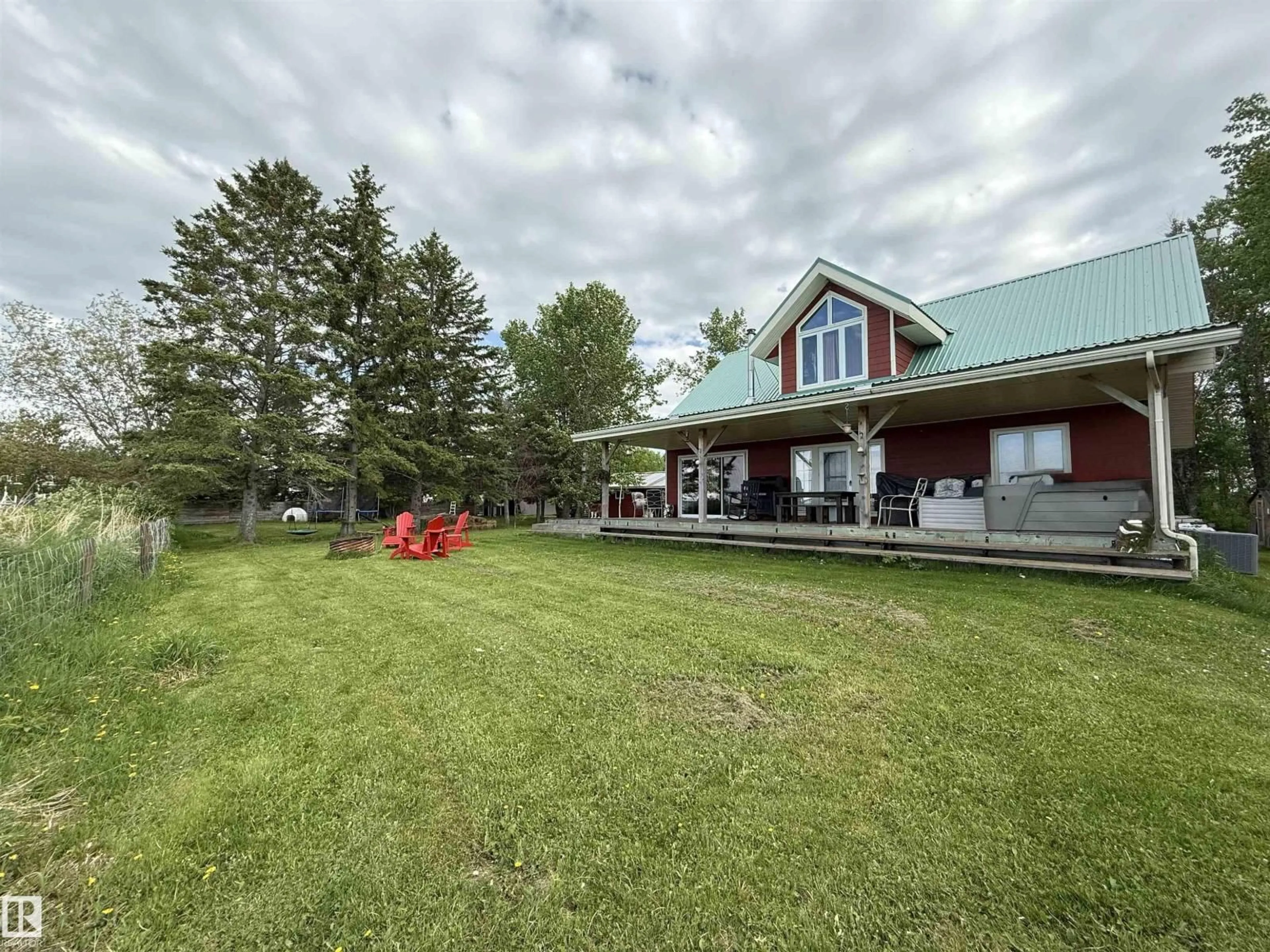 A pic from outside/outdoor area/front of a property/back of a property/a pic from drone, unknown for 210 LAKESHORE DR, Rural Wetaskiwin County Alberta T0C0T0
