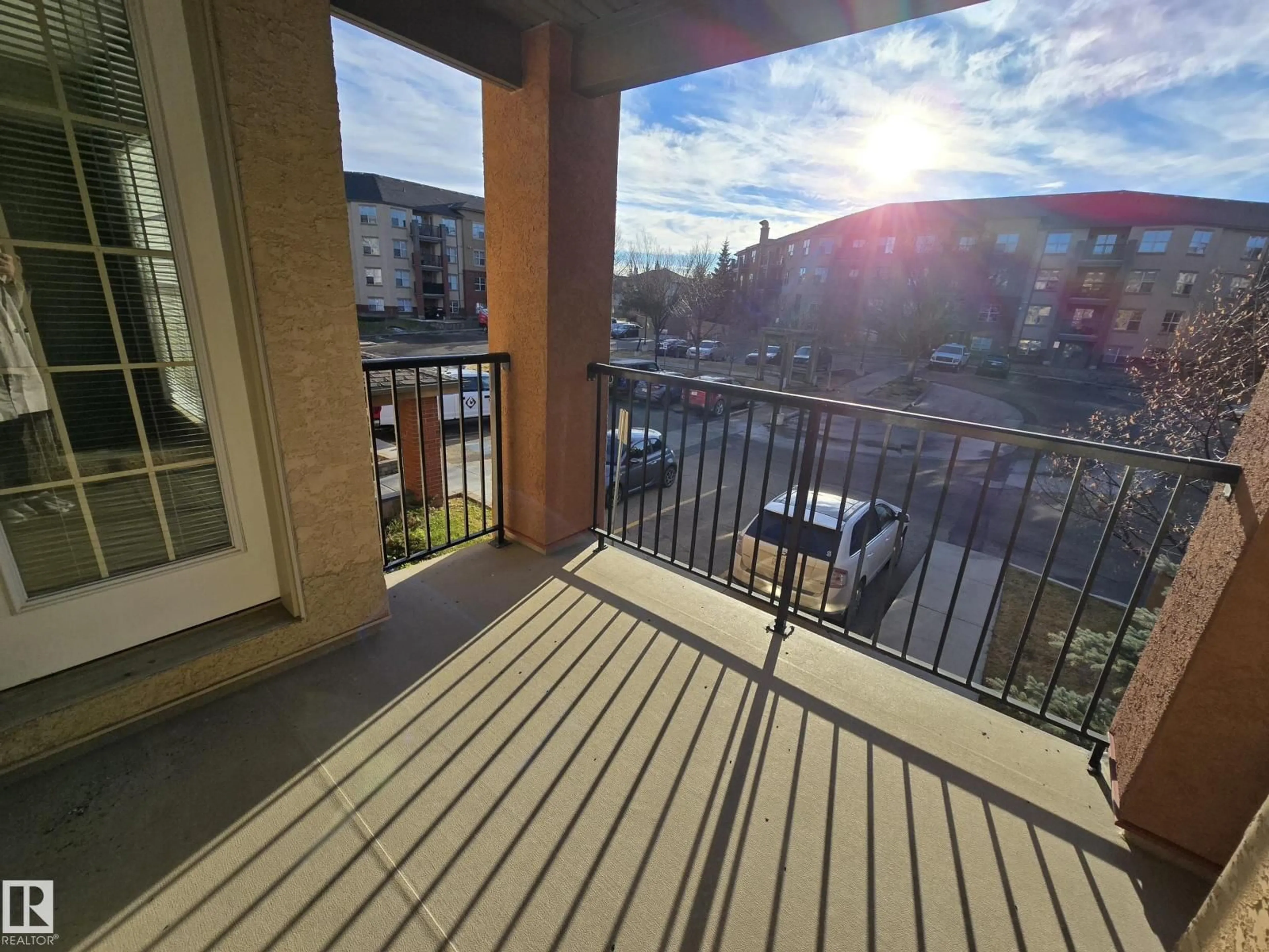 Balcony in the apartment, city buildings view from balcony for #211 - 11441 ELLERSLIE RD, Edmonton Alberta T6W1S9