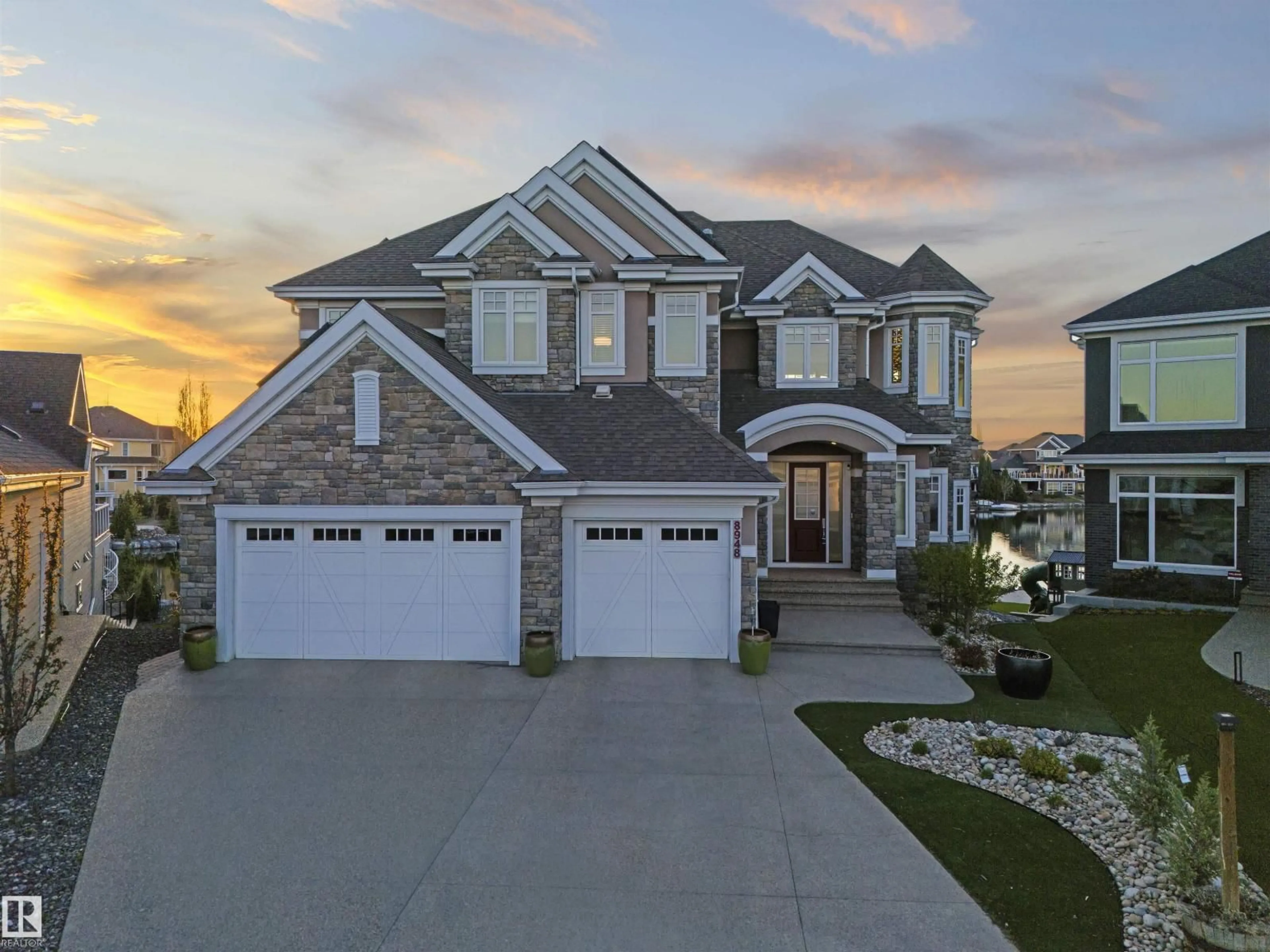 Home with vinyl exterior material, street for 8948 20 AV, Edmonton Alberta T6X2C5