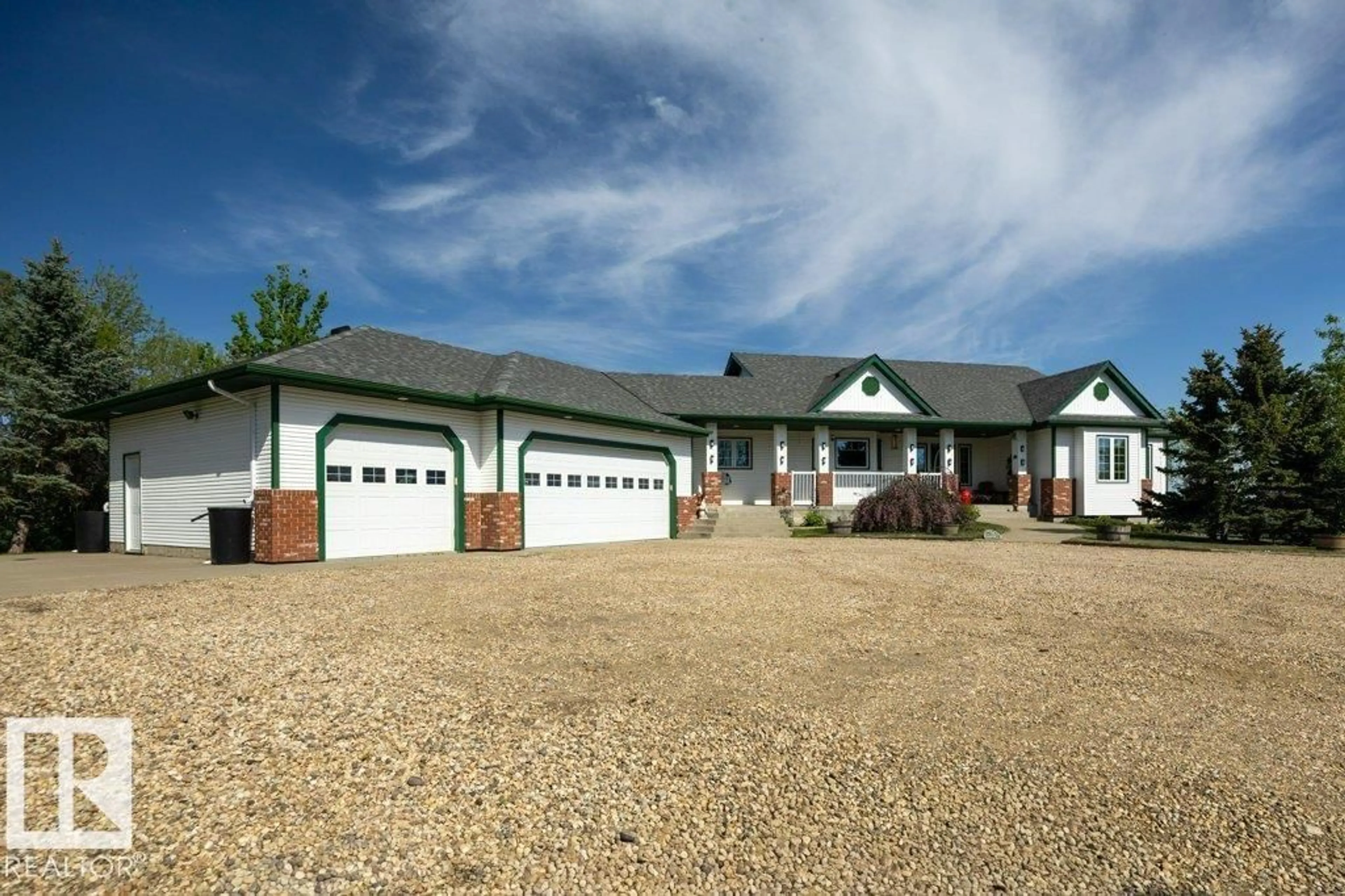 Home with vinyl exterior material, street for 49317 RGE RD 245, Rural Leduc County Alberta T4X2P8