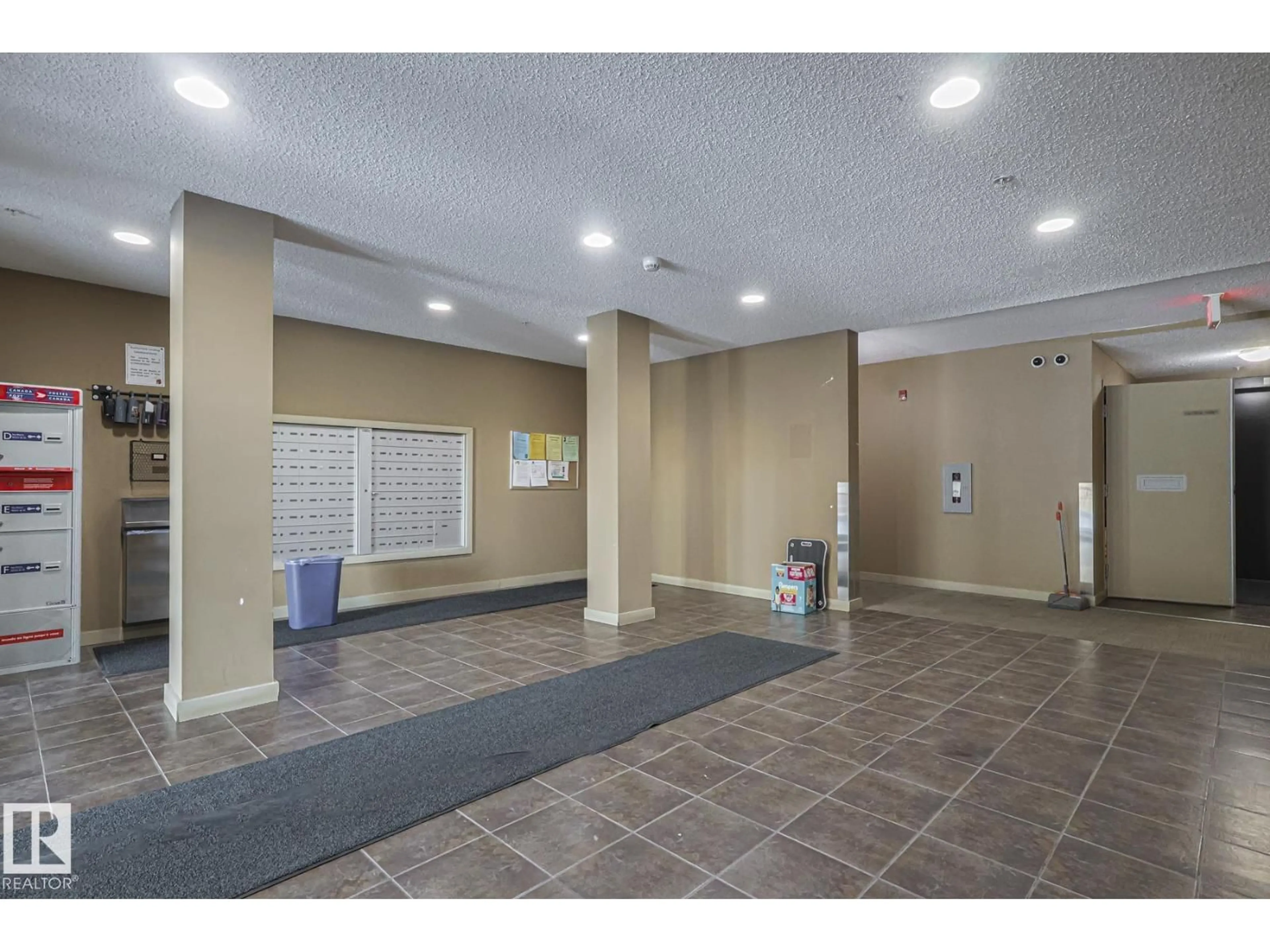 Indoor foyer for #118 - 12035 22 AV, Edmonton Alberta T6W2X9