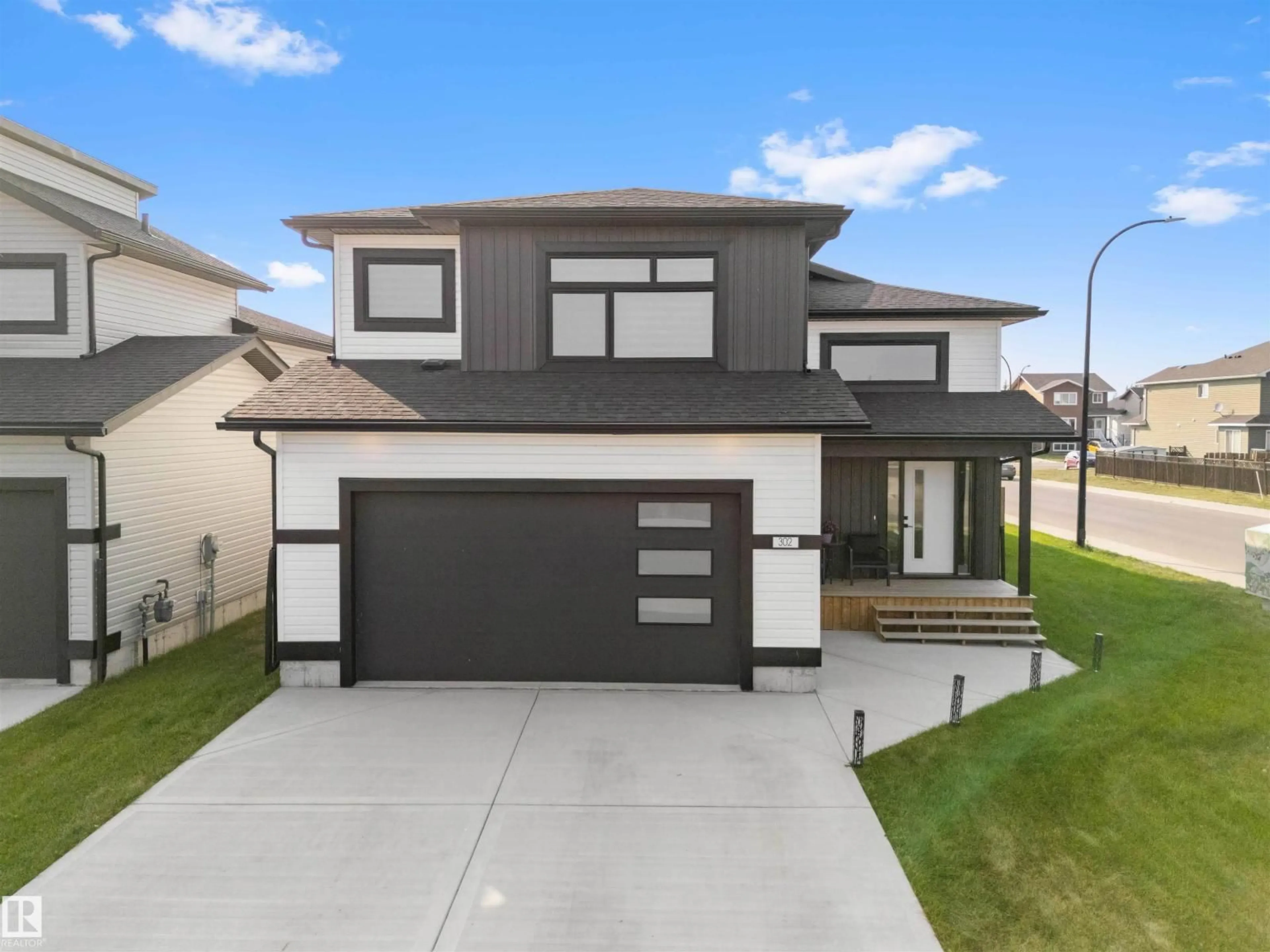Home with vinyl exterior material, street for 302 FUNDY WY, Cold Lake Alberta T9M0M4
