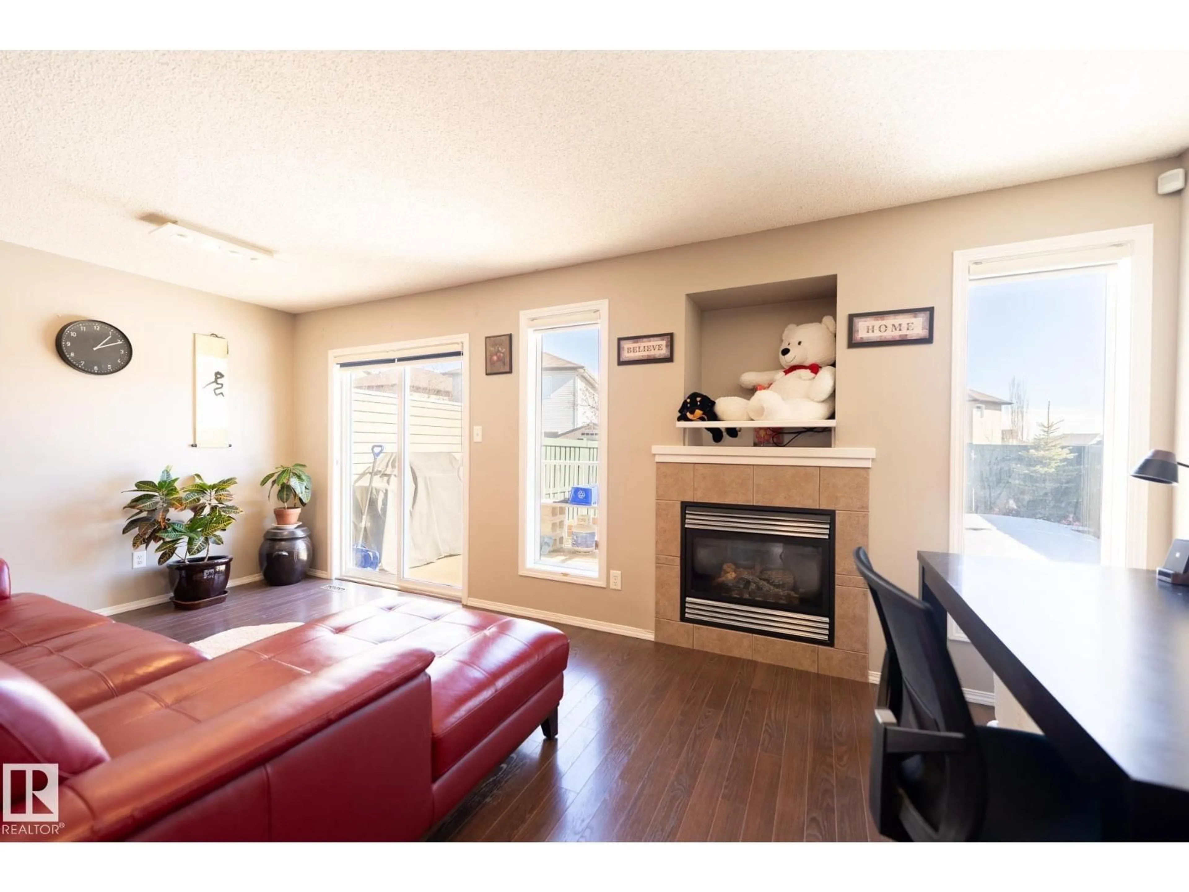 Living room with furniture, wood/laminate floor for 1863 119 ST, Edmonton Alberta T6W1W4