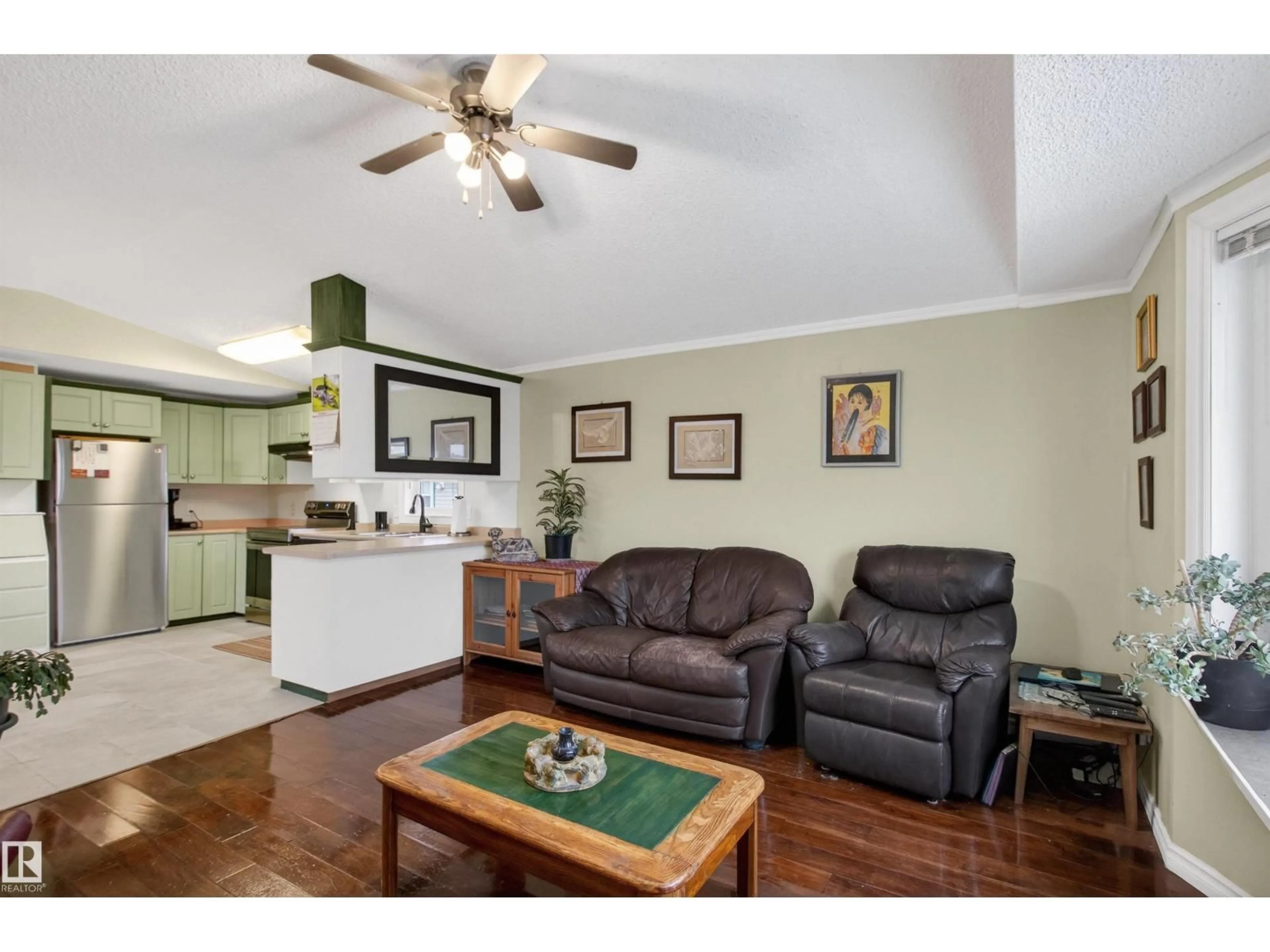 Living room with furniture, wood/laminate floor for 1789 JUBILEE LOOP, Sherwood Park Alberta T8H2M9