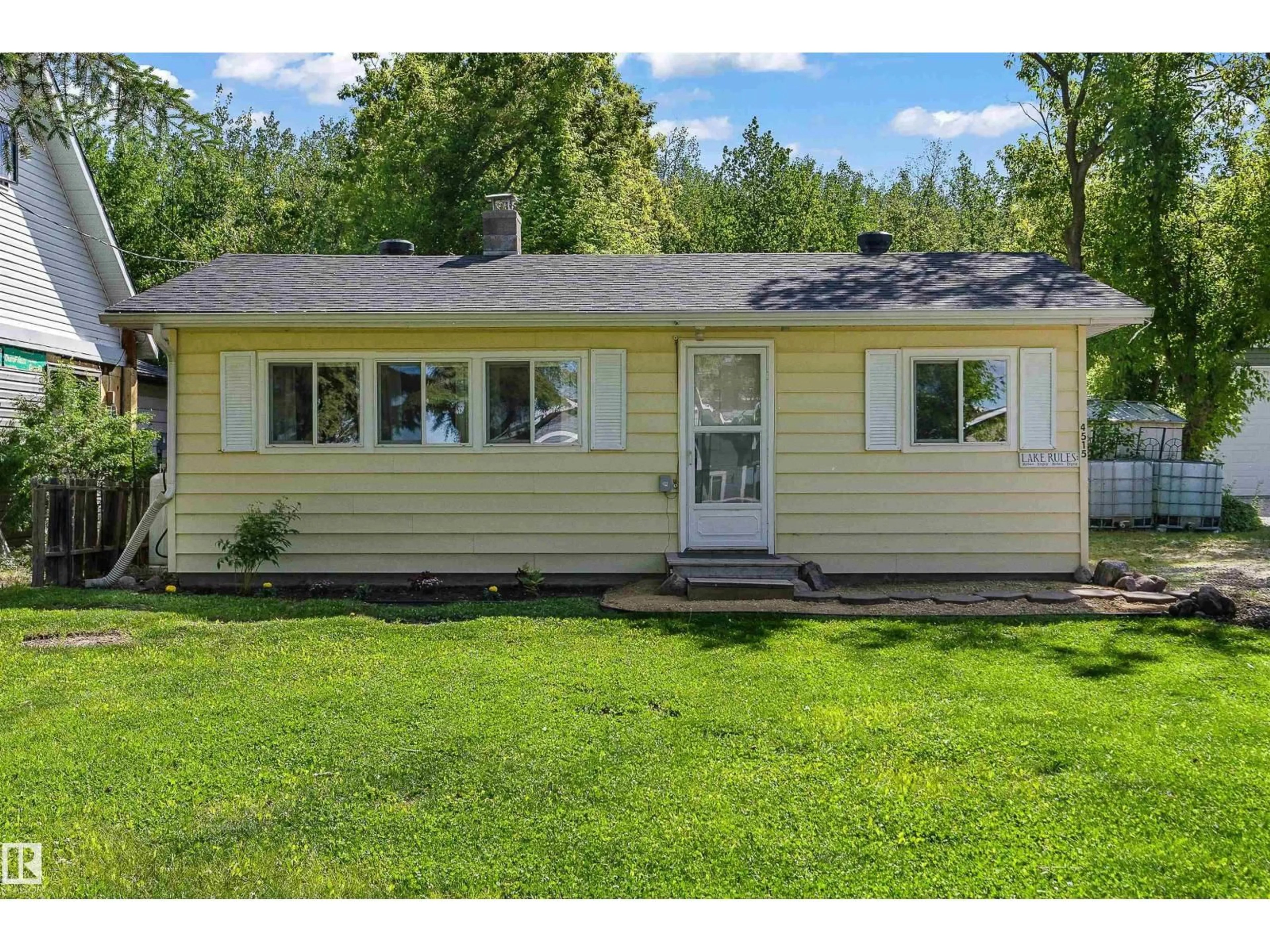 Home with vinyl exterior material, street for 4515 SUNSET DR, Rural Lac Ste. Anne County Alberta T0E0A0