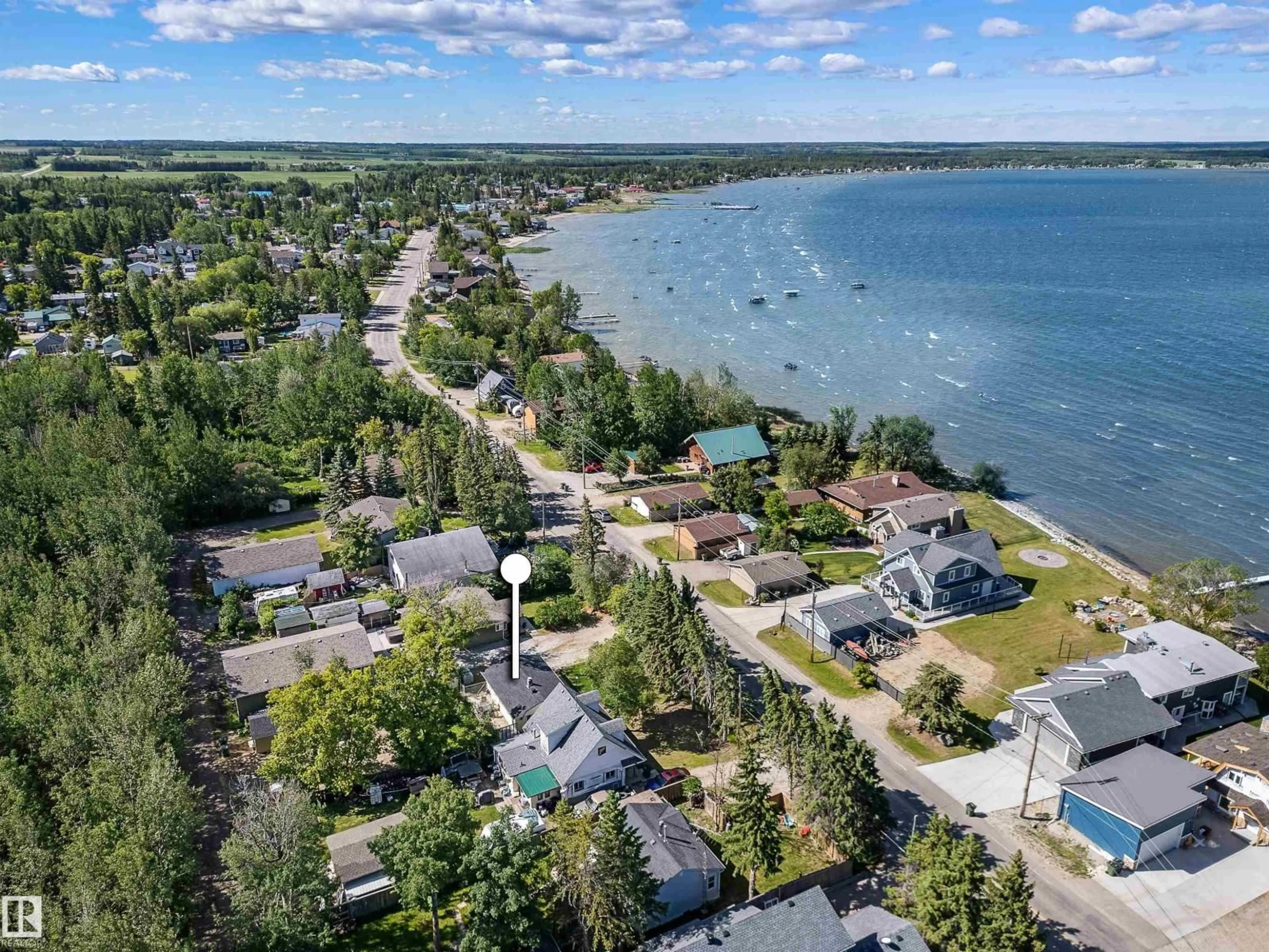 A pic from outside/outdoor area/front of a property/back of a property/a pic from drone, water/lake/river/ocean view for 4515 SUNSET DR, Rural Lac Ste. Anne County Alberta T0E0A0