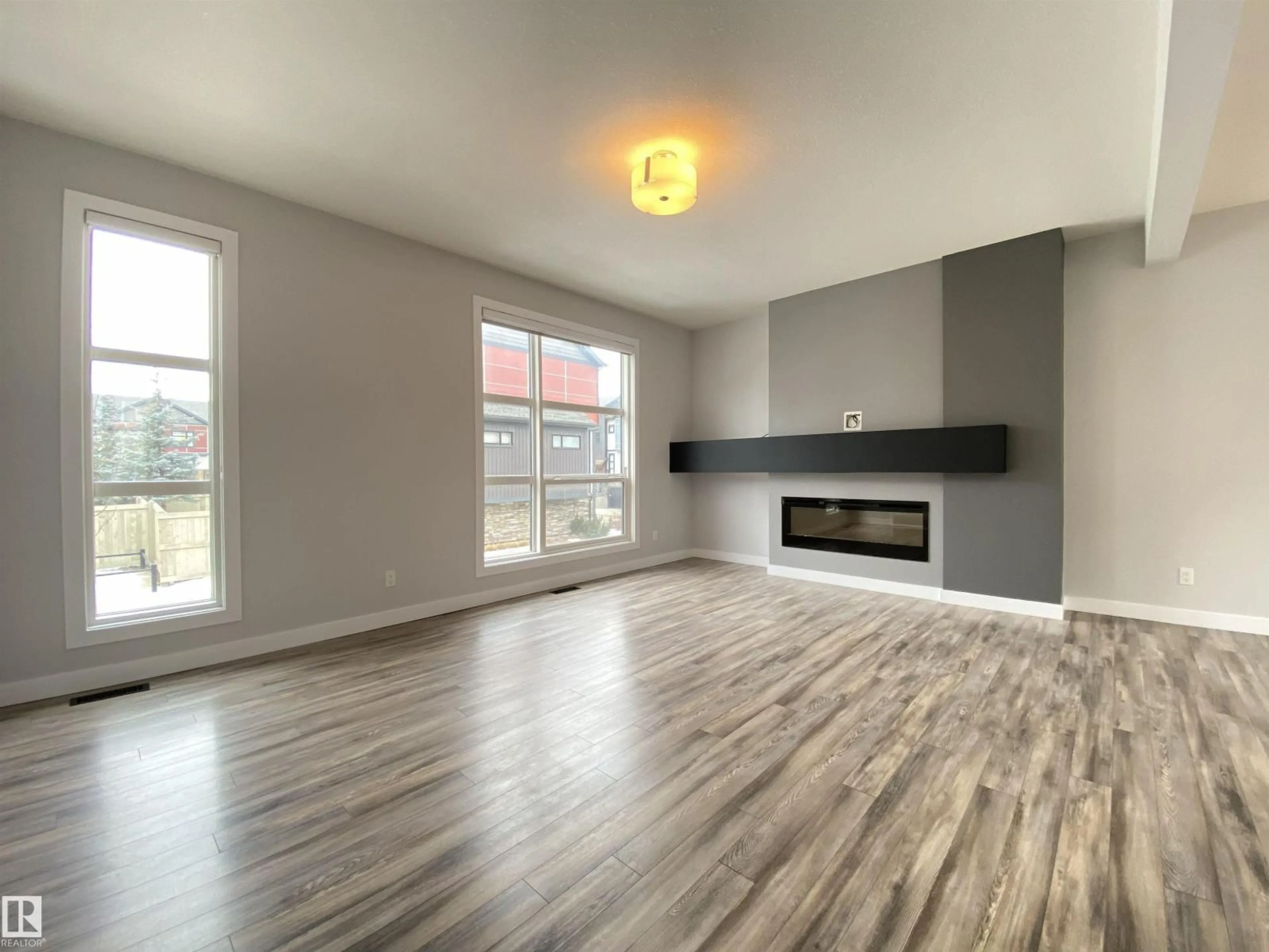 Living room with furniture, wood/laminate floor for 13 - 14715 125 ST NW, Edmonton Alberta T5X0G8