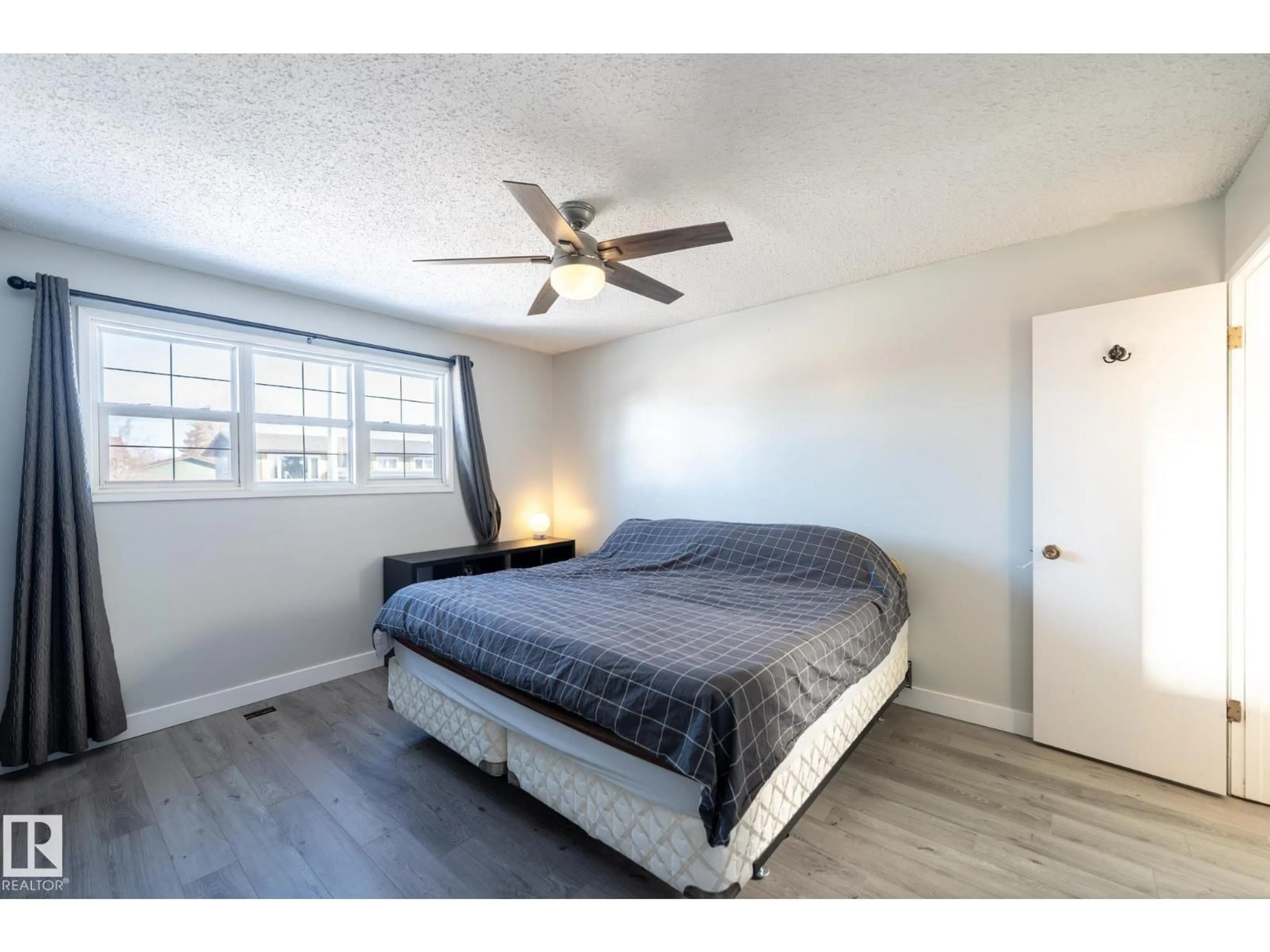 Bedroom with bed, wood/laminate floor for 4527 45 AV, Gibbons Alberta T0A1N0