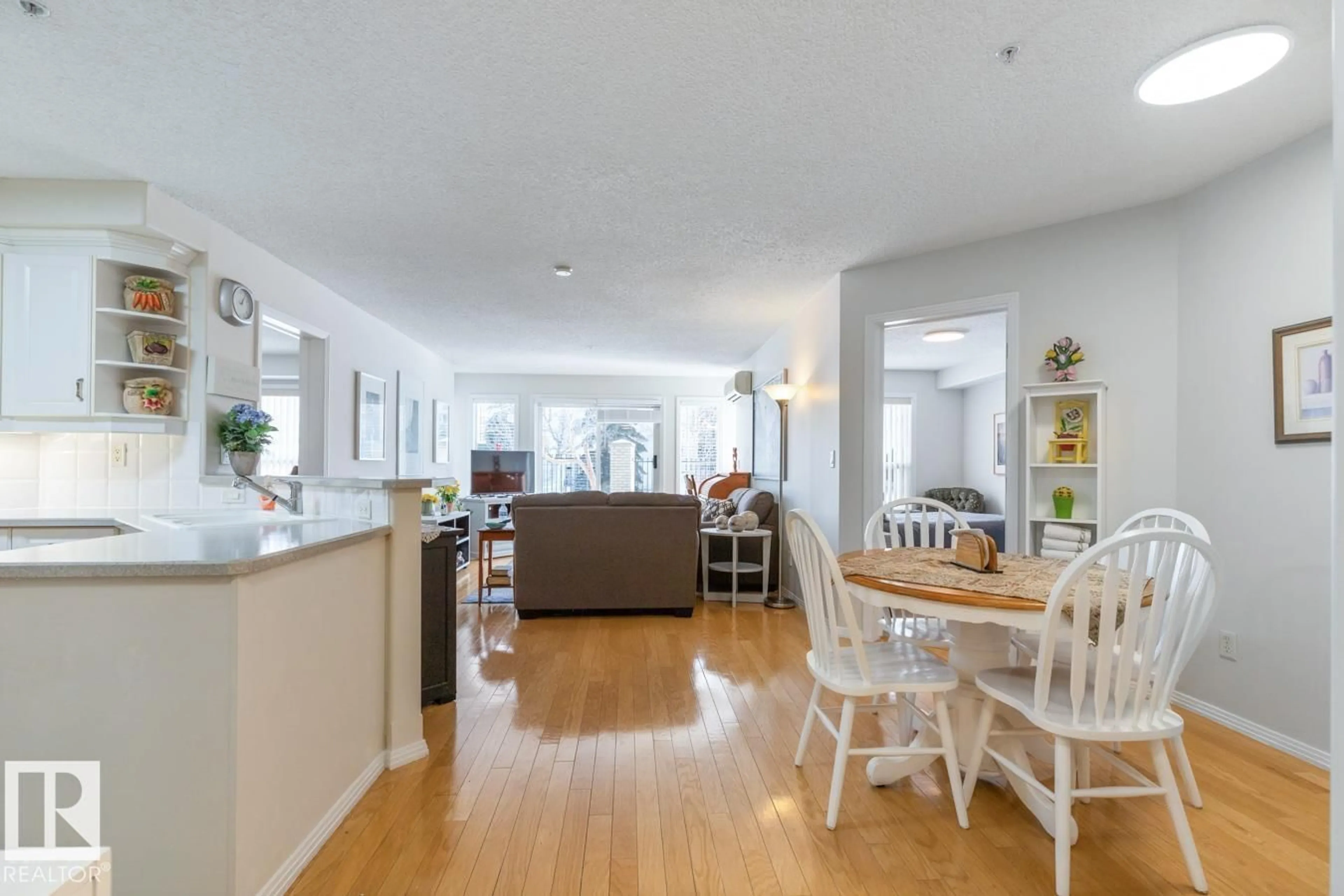 Open concept kitchen, wood/laminate floor for #133 - 9704 174 ST NW, Edmonton Alberta T5T6J4