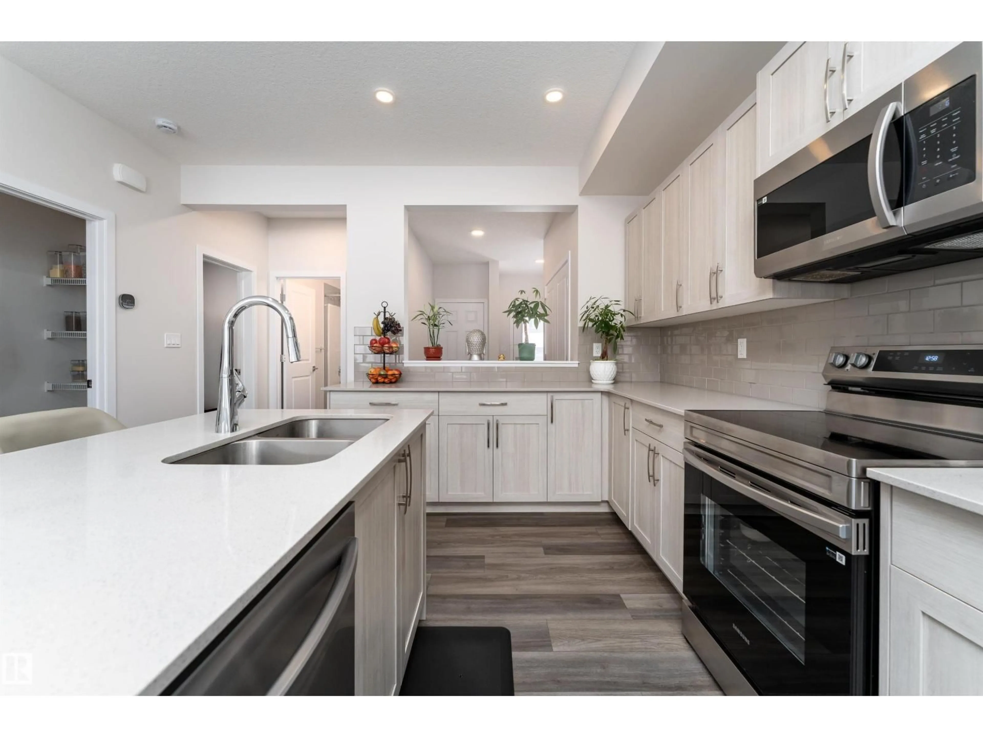 Open concept kitchen, ceramic/tile floor for 2120 MUCKLEPLUM CR, Edmonton Alberta T6X3H1