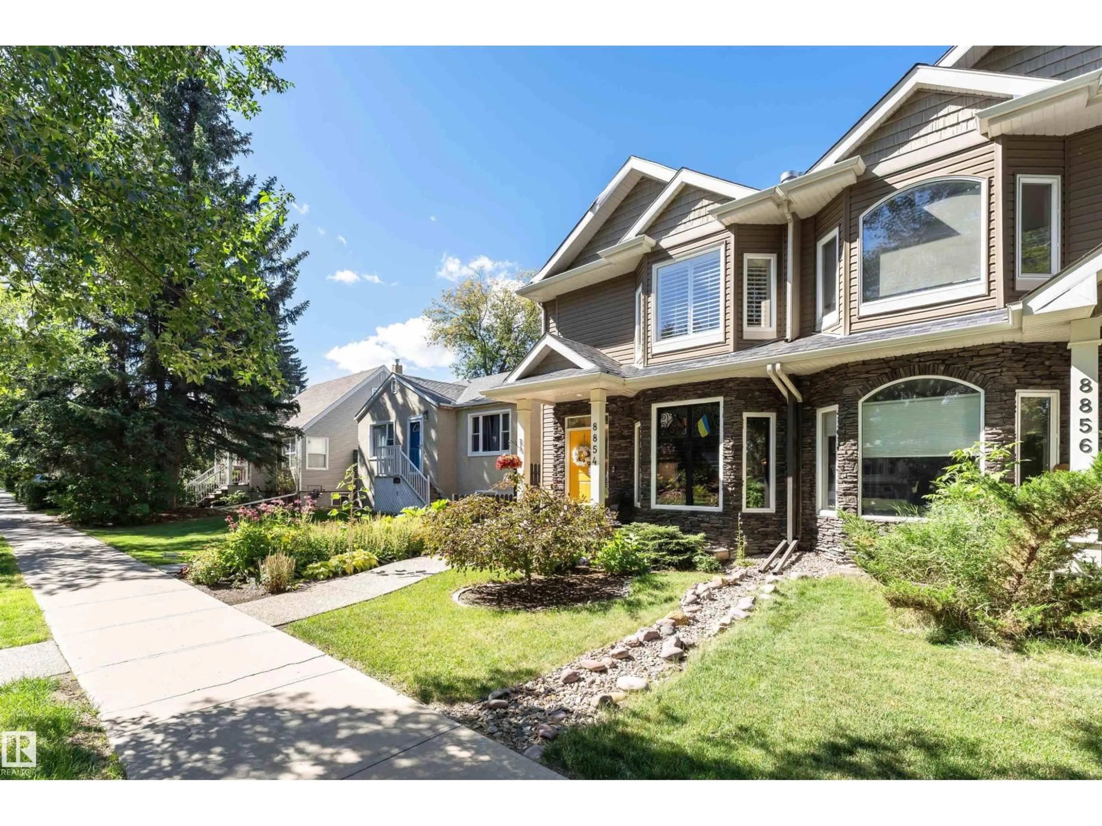 Home with vinyl exterior material, street for 8854 89 ST, Edmonton Alberta T6C3K6