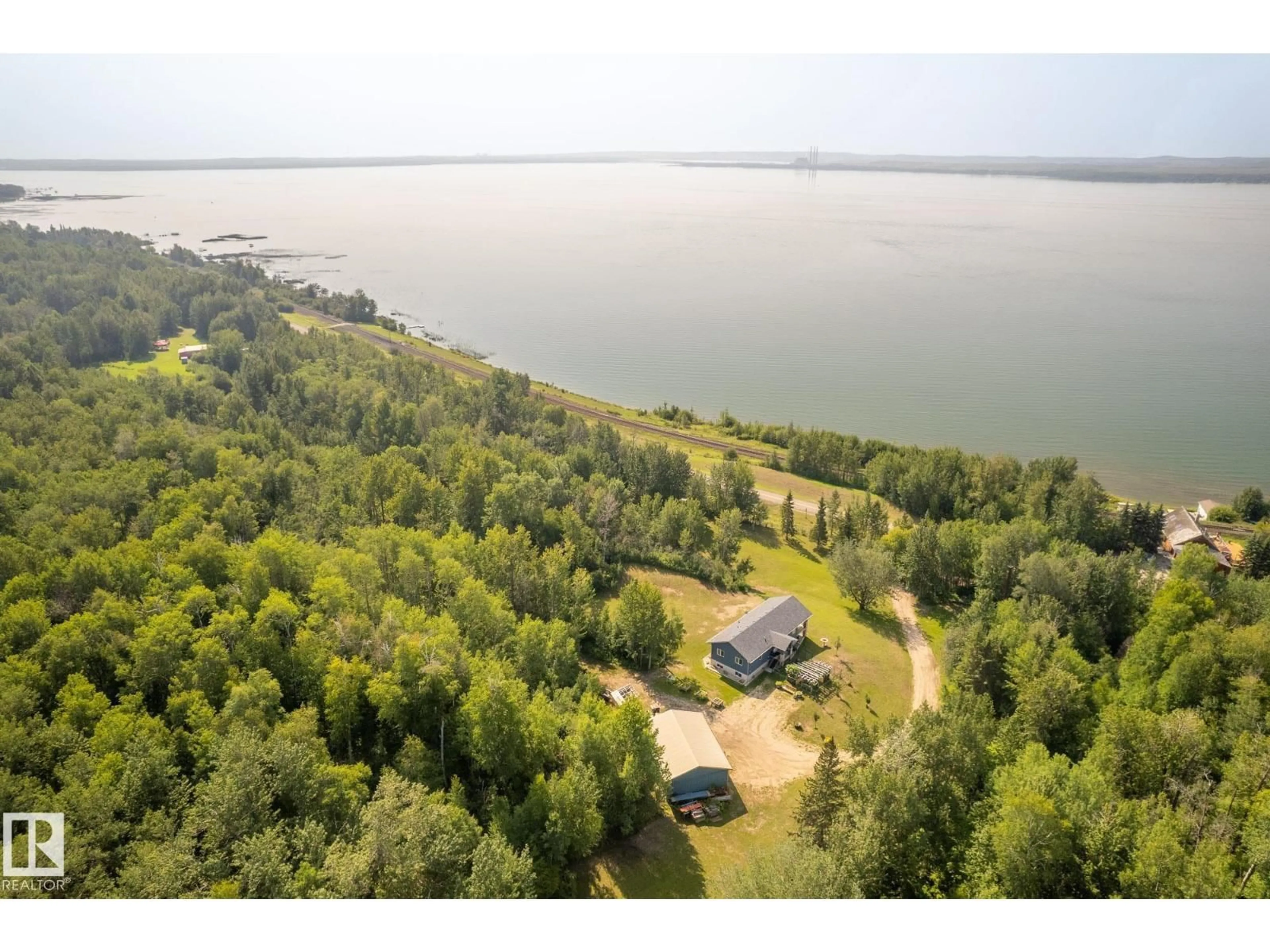 A pic from outside/outdoor area/front of a property/back of a property/a pic from drone, water/lake/river/ocean view for 4518 LAKESHORE RD, Rural Parkland County Alberta T0E2K0