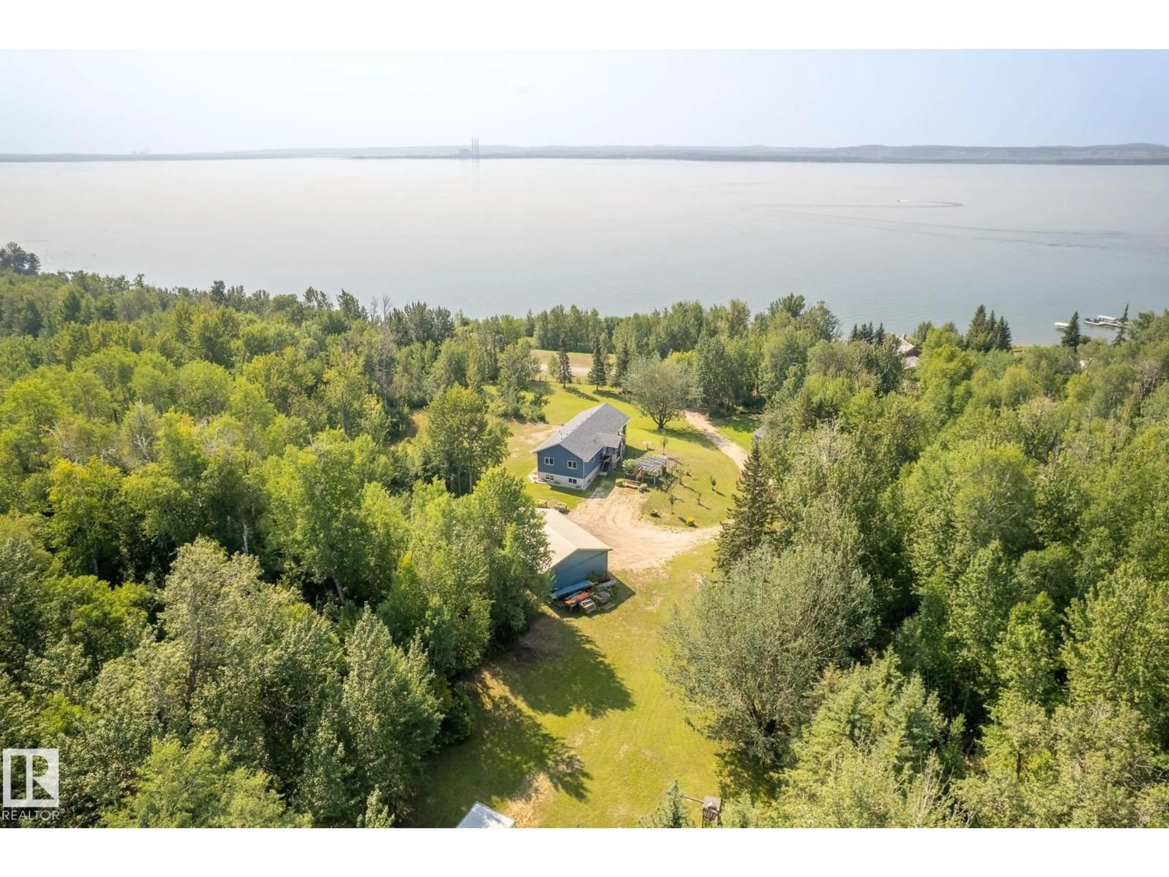 A pic from outside/outdoor area/front of a property/back of a property/a pic from drone, water/lake/river/ocean view for 4518 LAKESHORE RD, Rural Parkland County Alberta T0E2K0