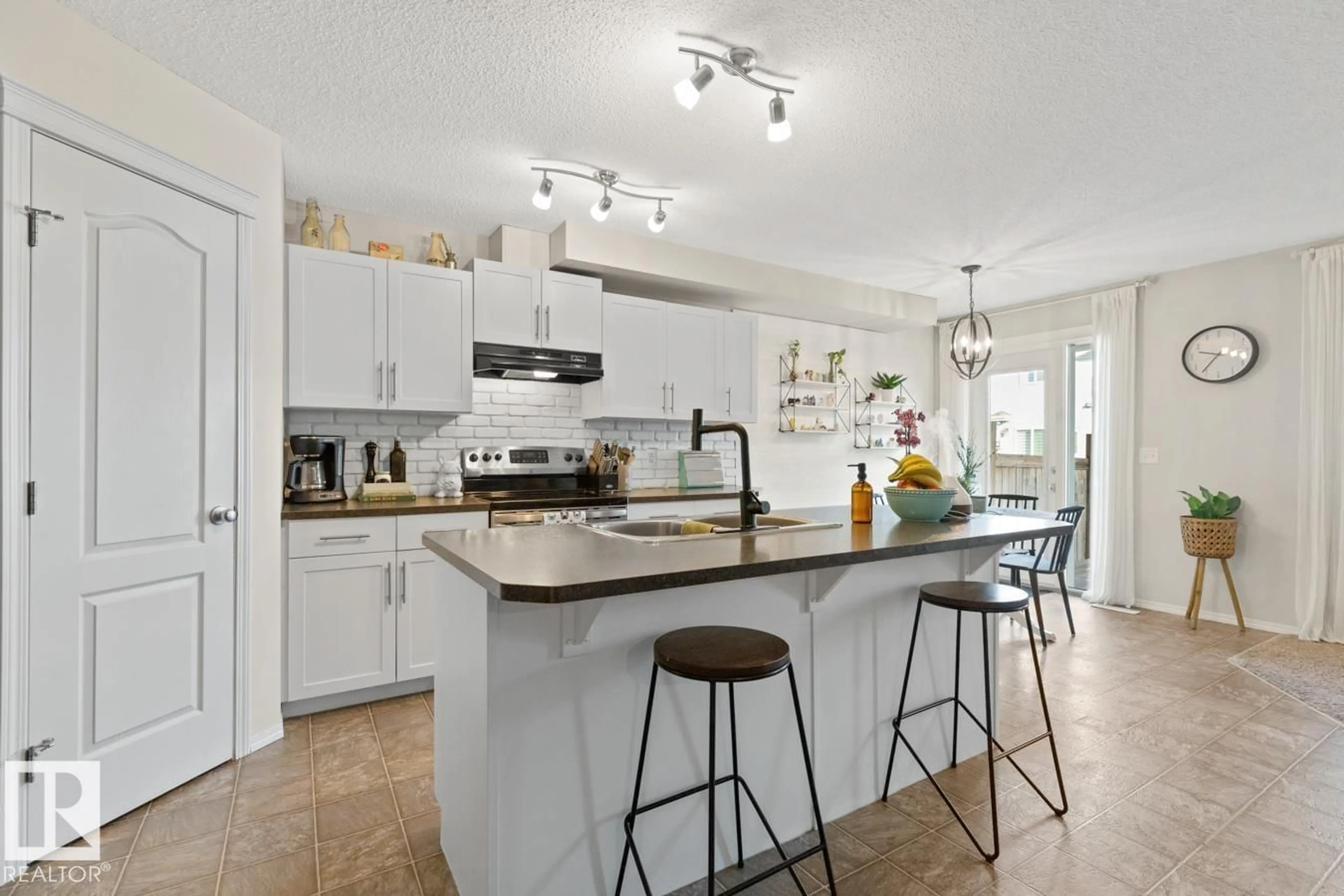 Open concept kitchen, ceramic/tile floor for 3124 16 AV, Edmonton Alberta T6T0T8