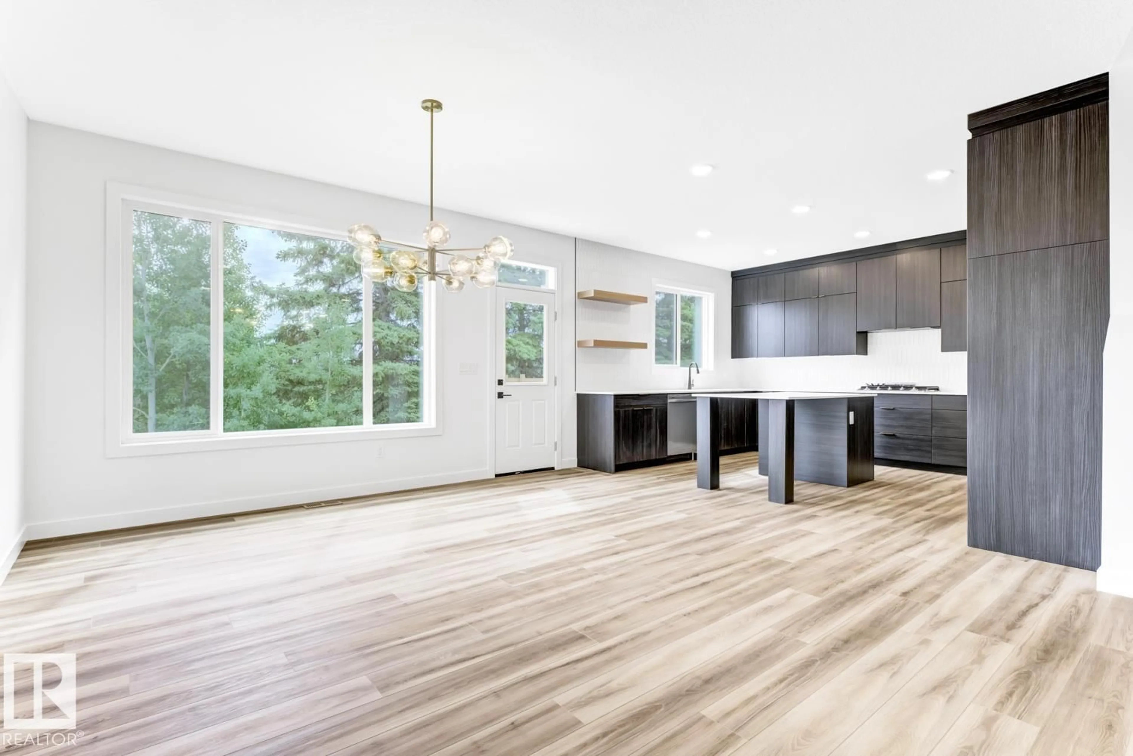 Open concept kitchen, wood/laminate floor for 2010 GENESIS LN, Stony Plain Alberta T7Z0K5