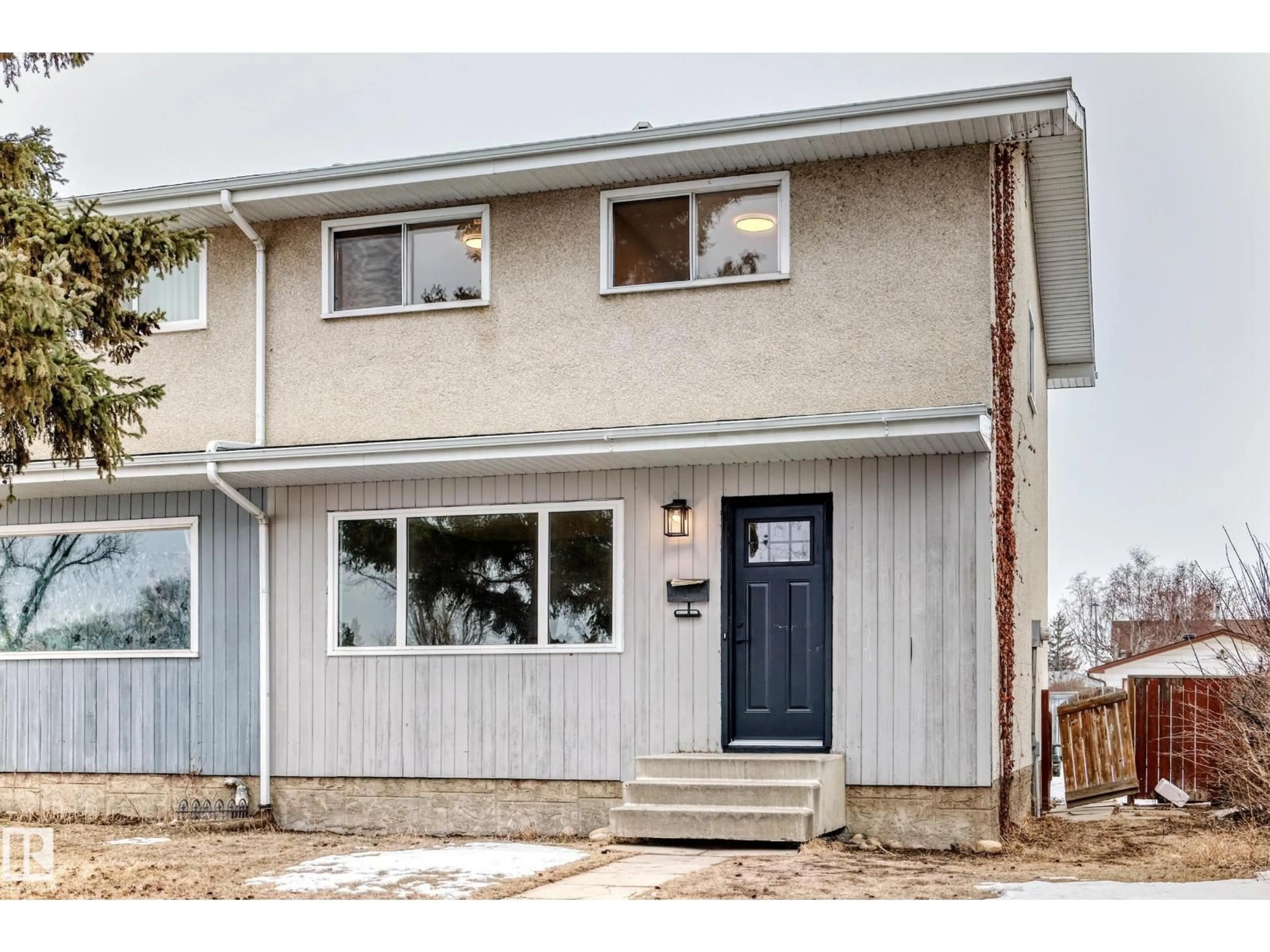 Home with vinyl exterior material, street for NW - 6808 149 AV, Edmonton Alberta T5C2V2