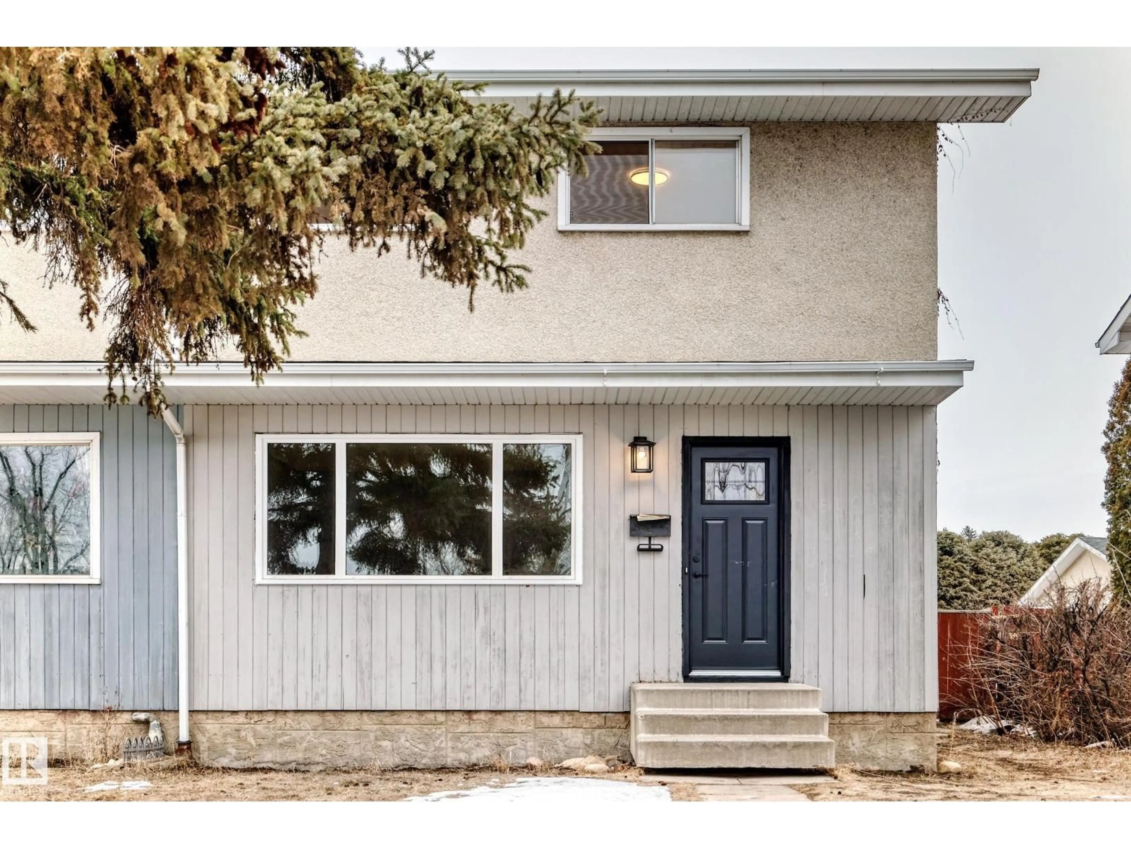 Home with vinyl exterior material, street for NW - 6808 149 AV, Edmonton Alberta T5C2V2