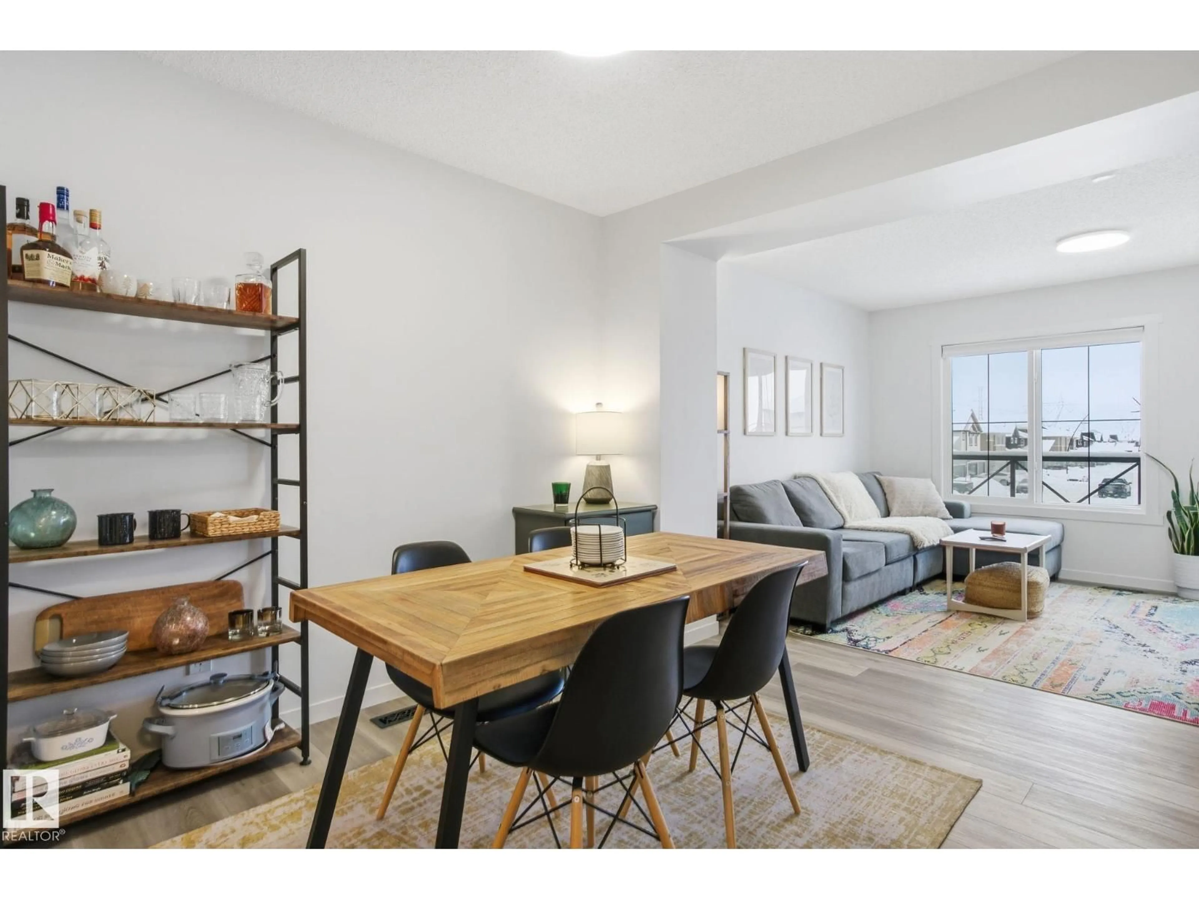 Living room with furniture, wood/laminate floor for NW - 2826 192 ST, Edmonton Alberta T6X3B5