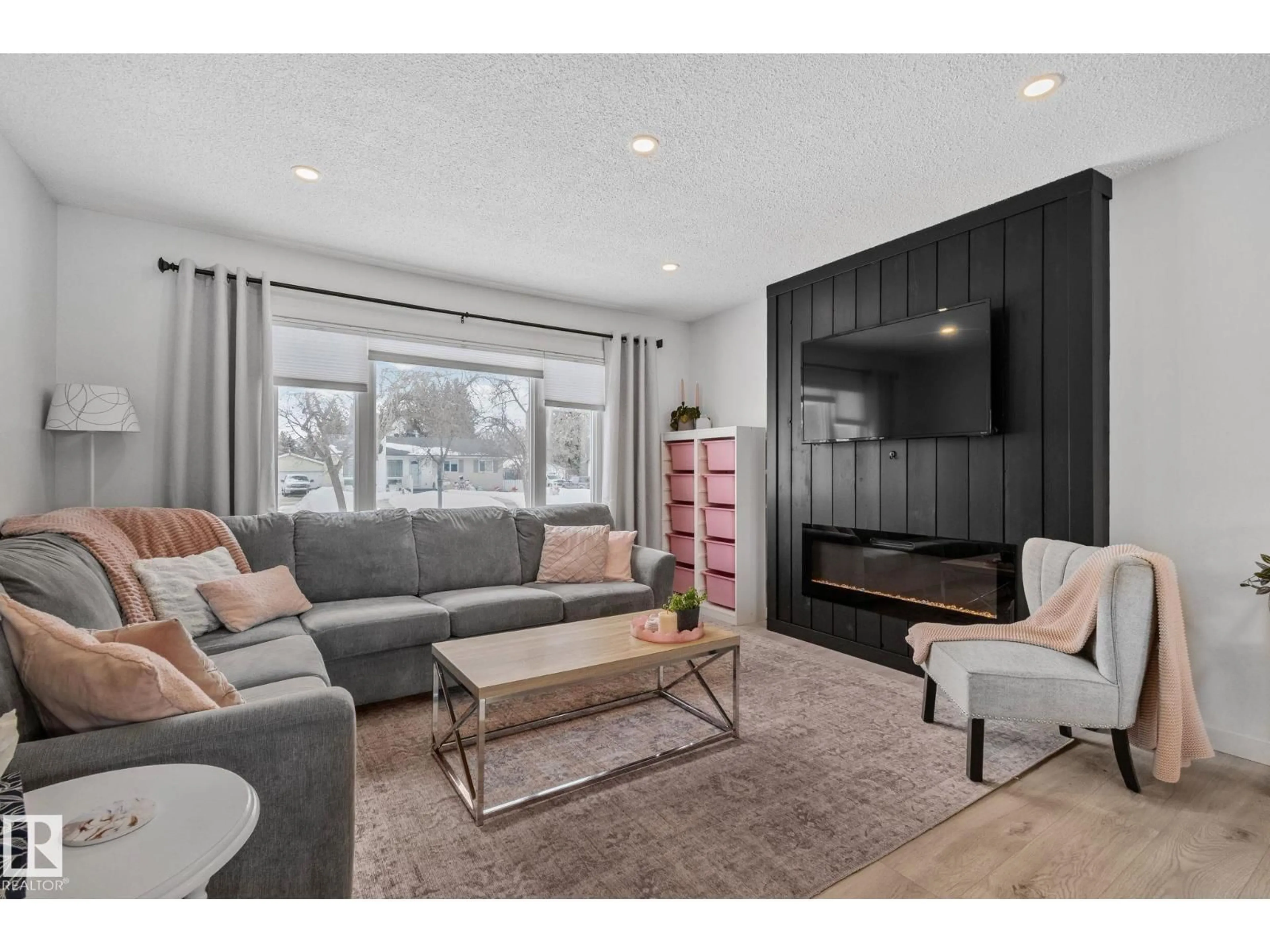 Living room with furniture, wood/laminate floor for 8942 94 AV, Fort Saskatchewan Alberta T8L1B4