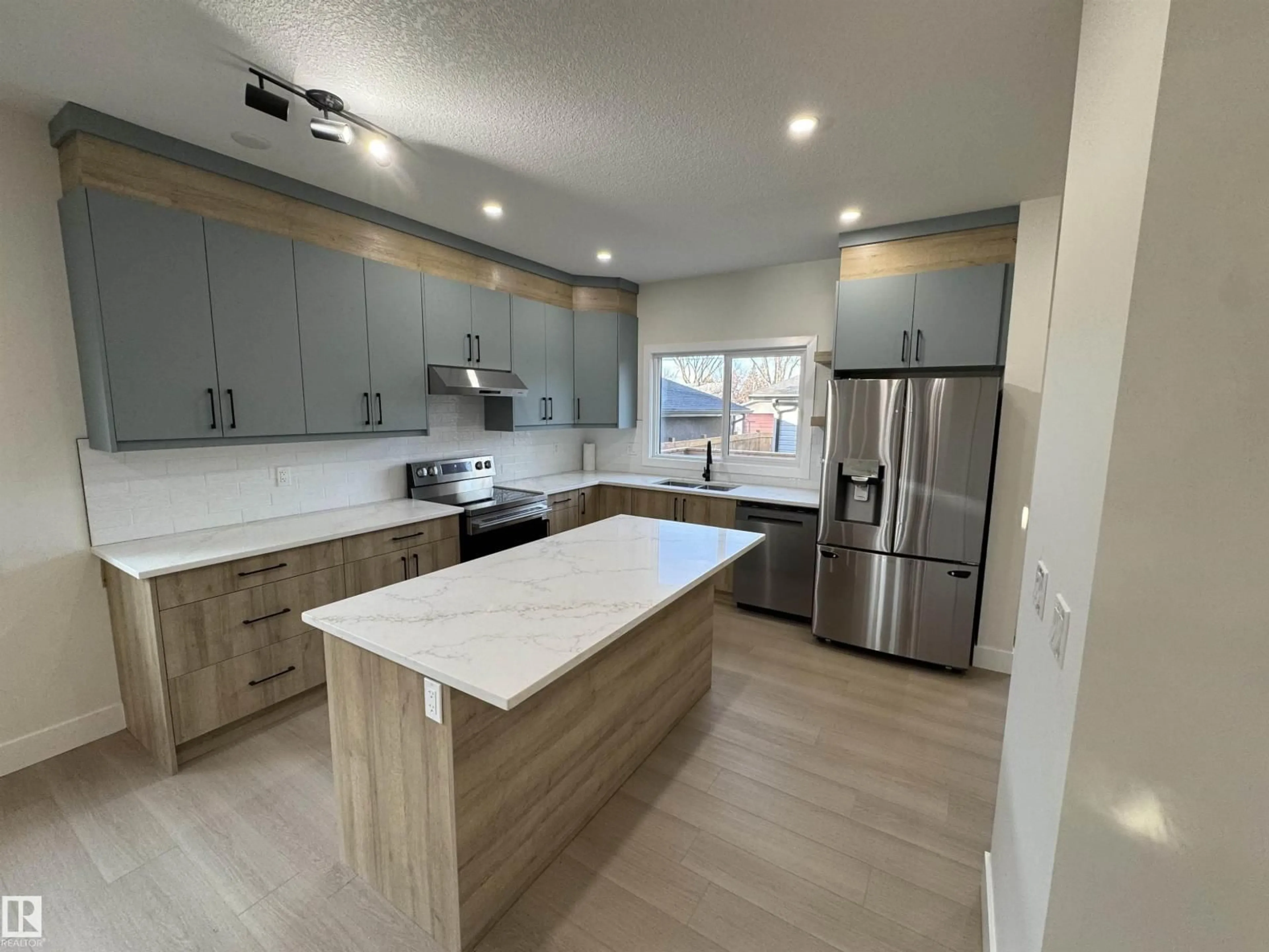 Open concept kitchen, unknown for 7938 91 AV, Edmonton Alberta T6C1R1