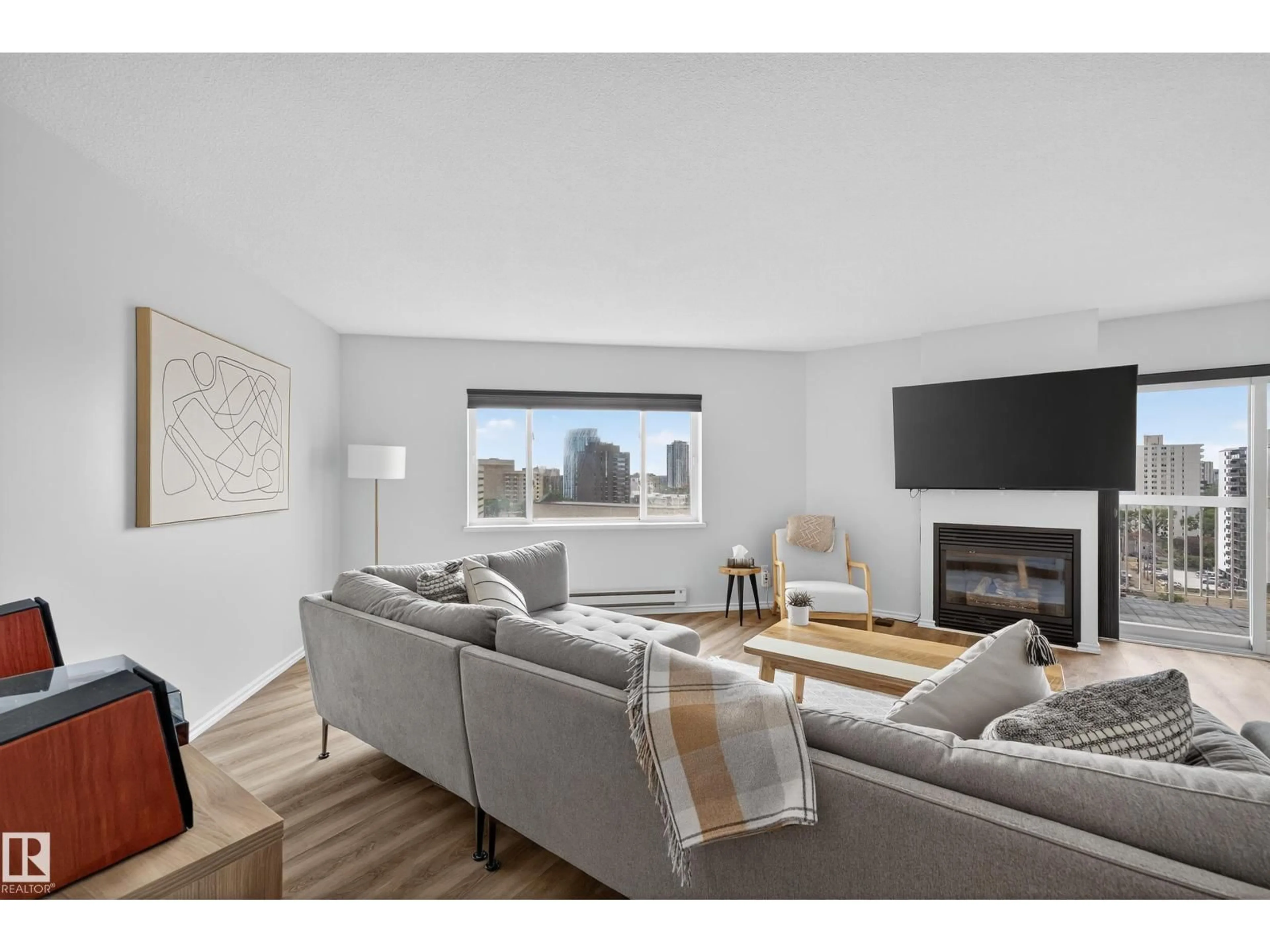 Living room with furniture, wood/laminate floor for #1303 - 10130 114 ST, Edmonton Alberta T5K2S6