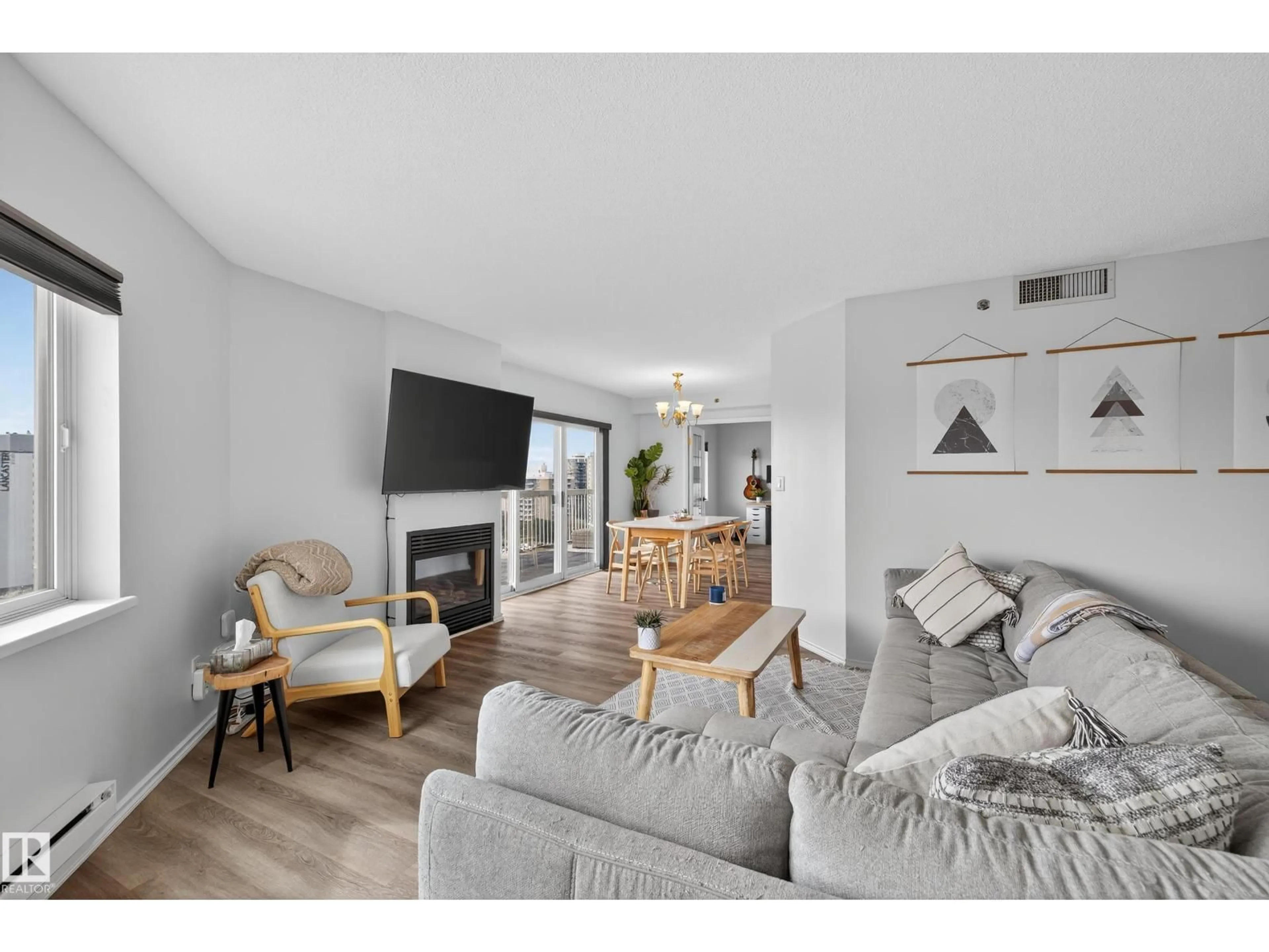 Living room with furniture, wood/laminate floor for #1303 - 10130 114 ST, Edmonton Alberta T5K2S6