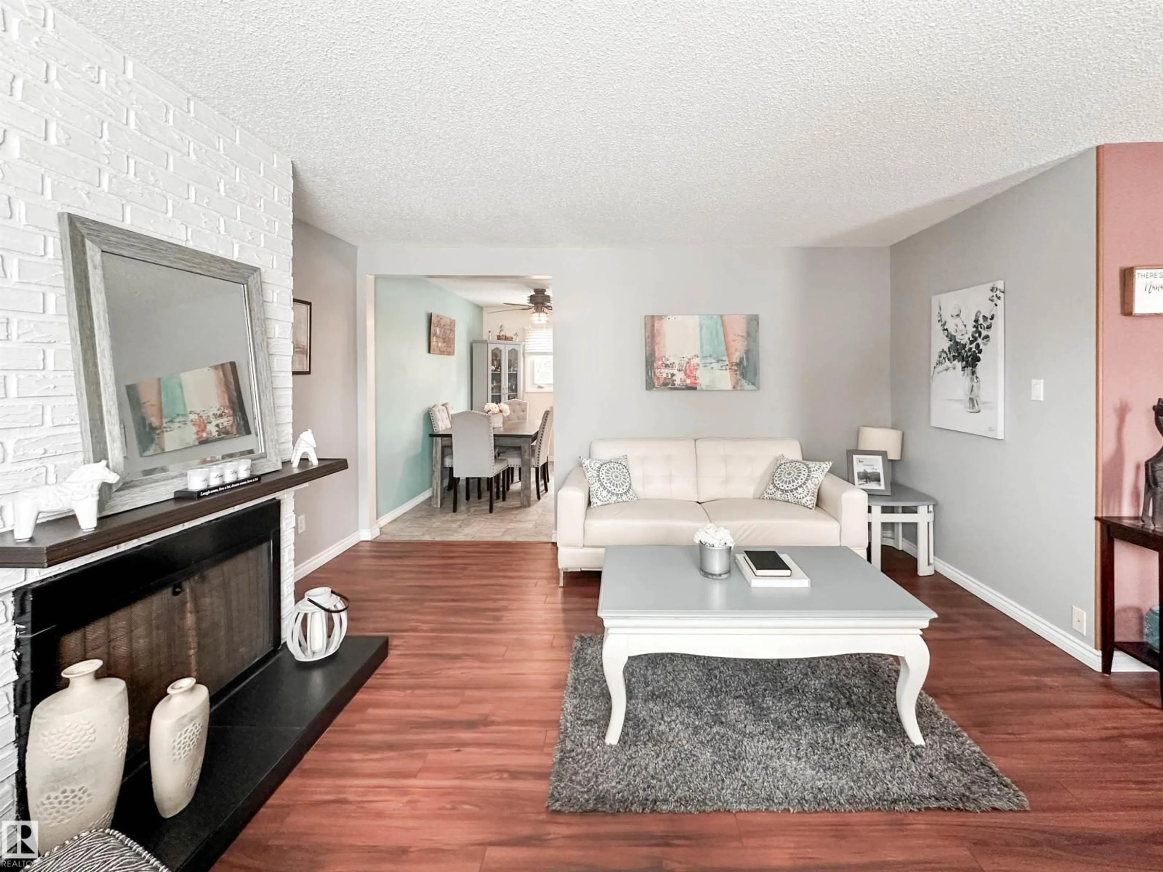 Living room with furniture, wood/laminate floor for 20 BRISTOW CR, Spruce Grove Alberta T7X2C9