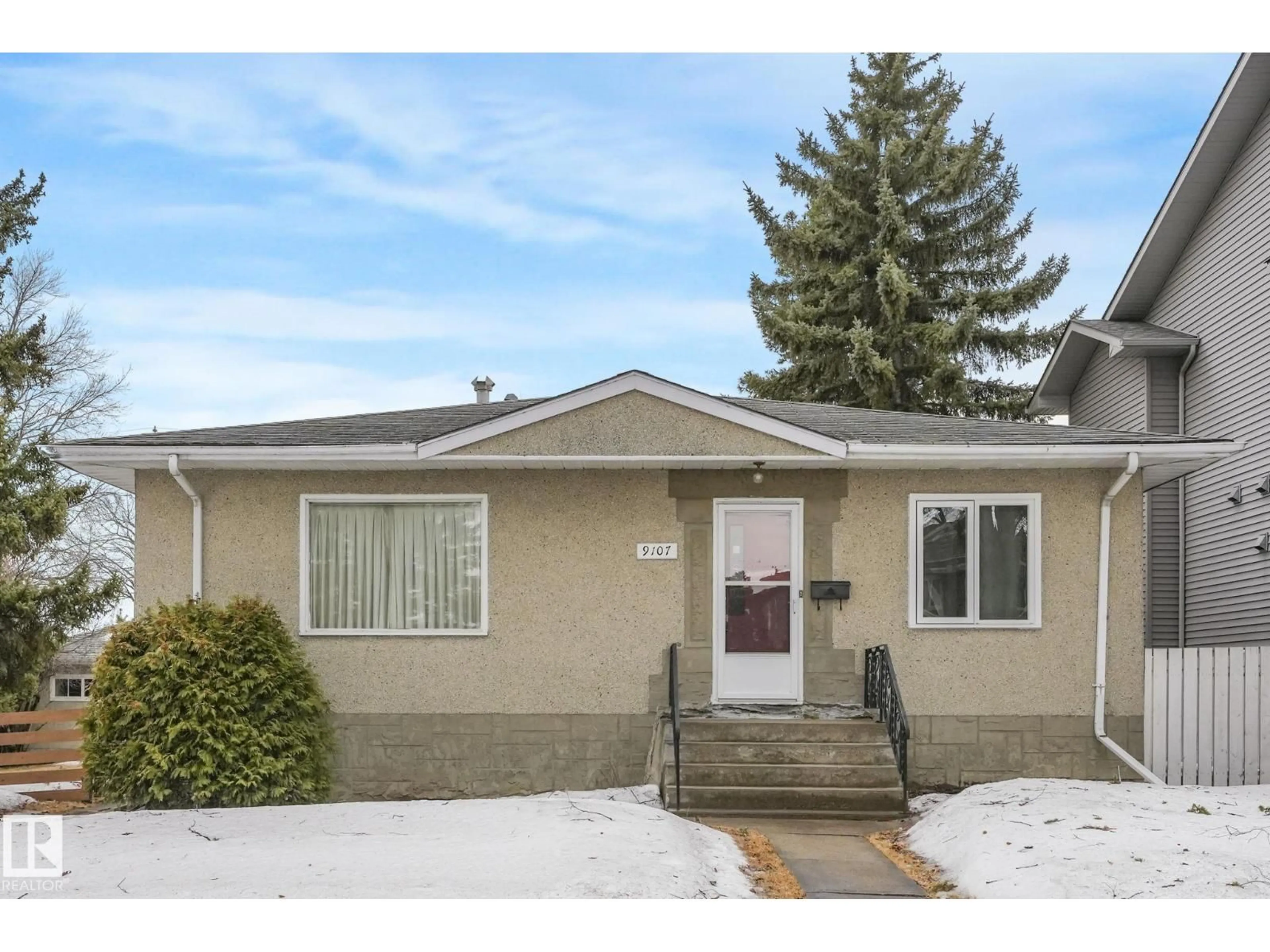 Home with vinyl exterior material, street for 9107 65 AV, Edmonton Alberta T6E0J8