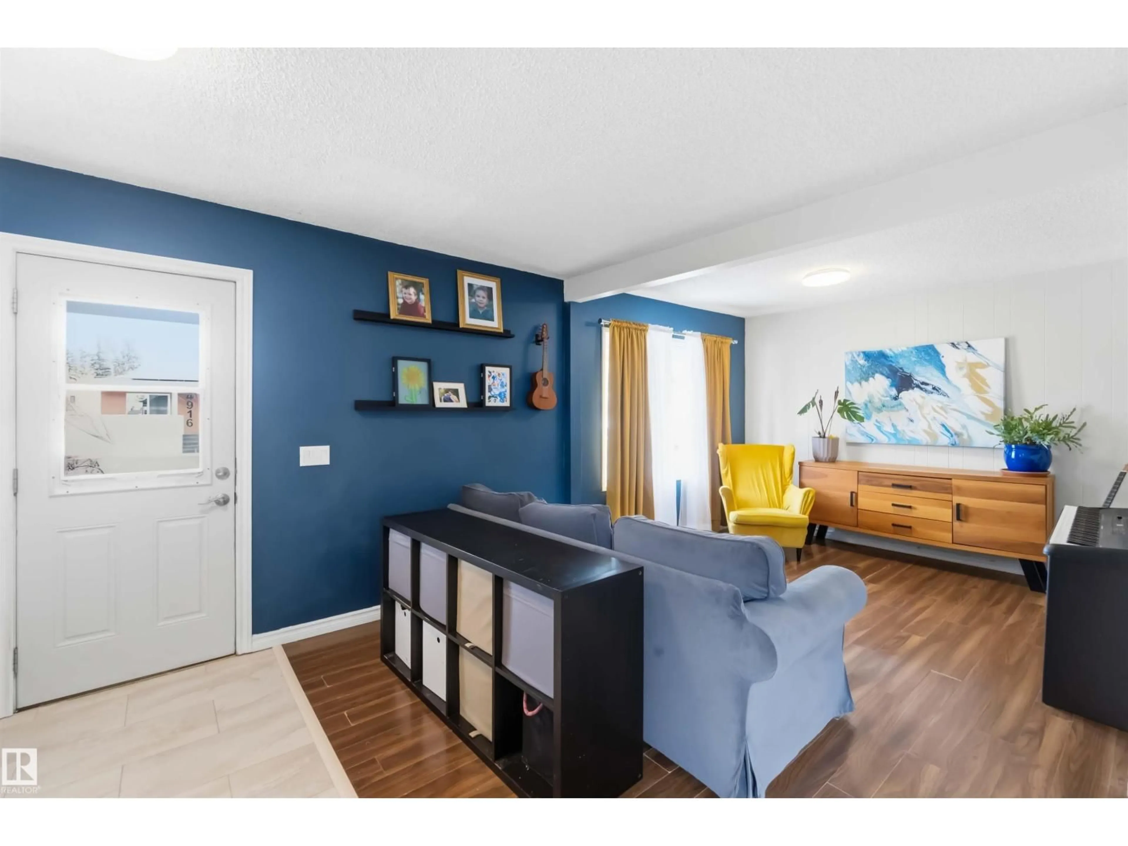 Living room with furniture, wood/laminate floor for 4915 50 AV, Bon Accord Alberta T0A0K0