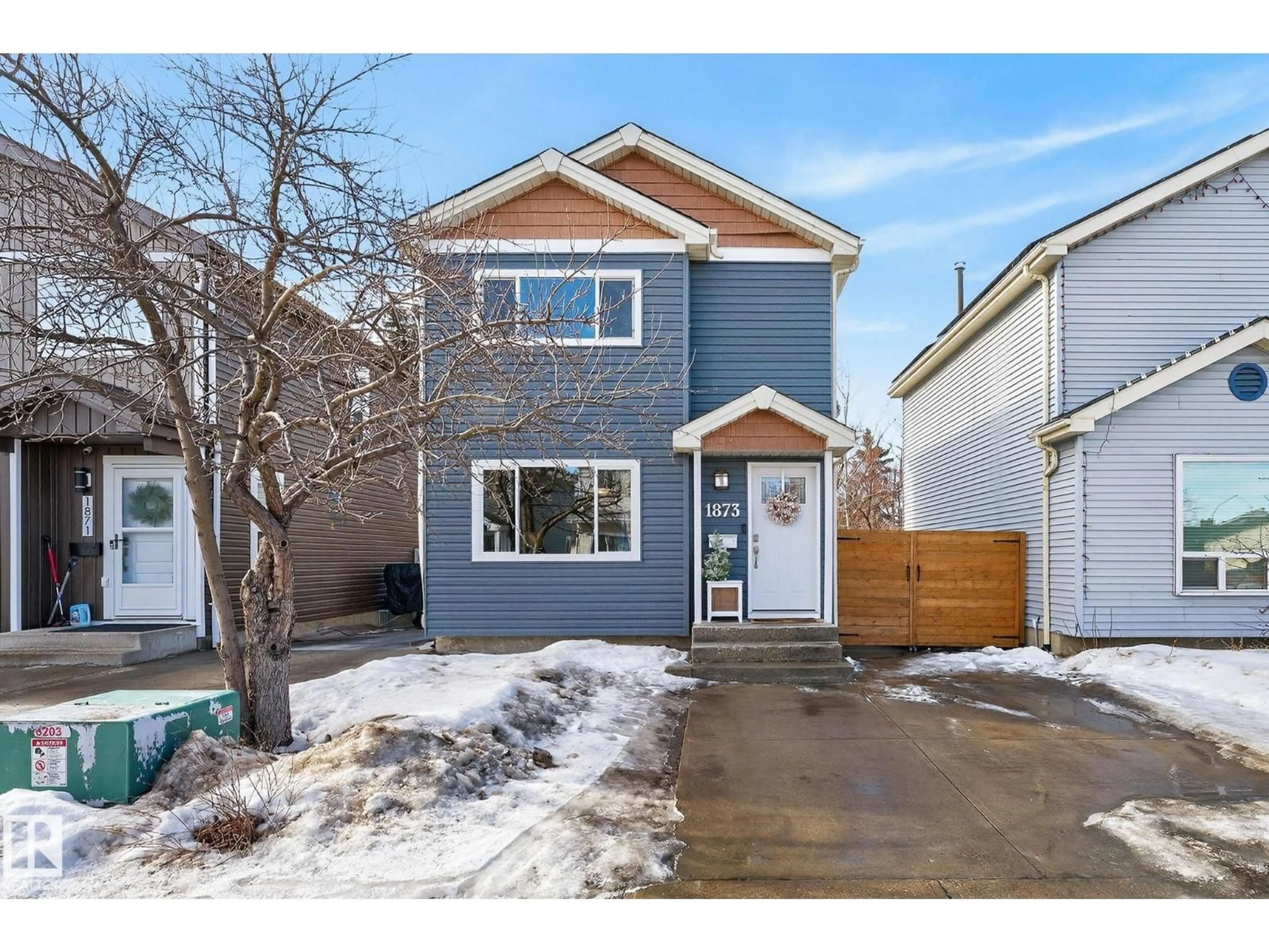 Home with vinyl exterior material, street for 1873 151 AV, Edmonton Alberta T5Y1W1