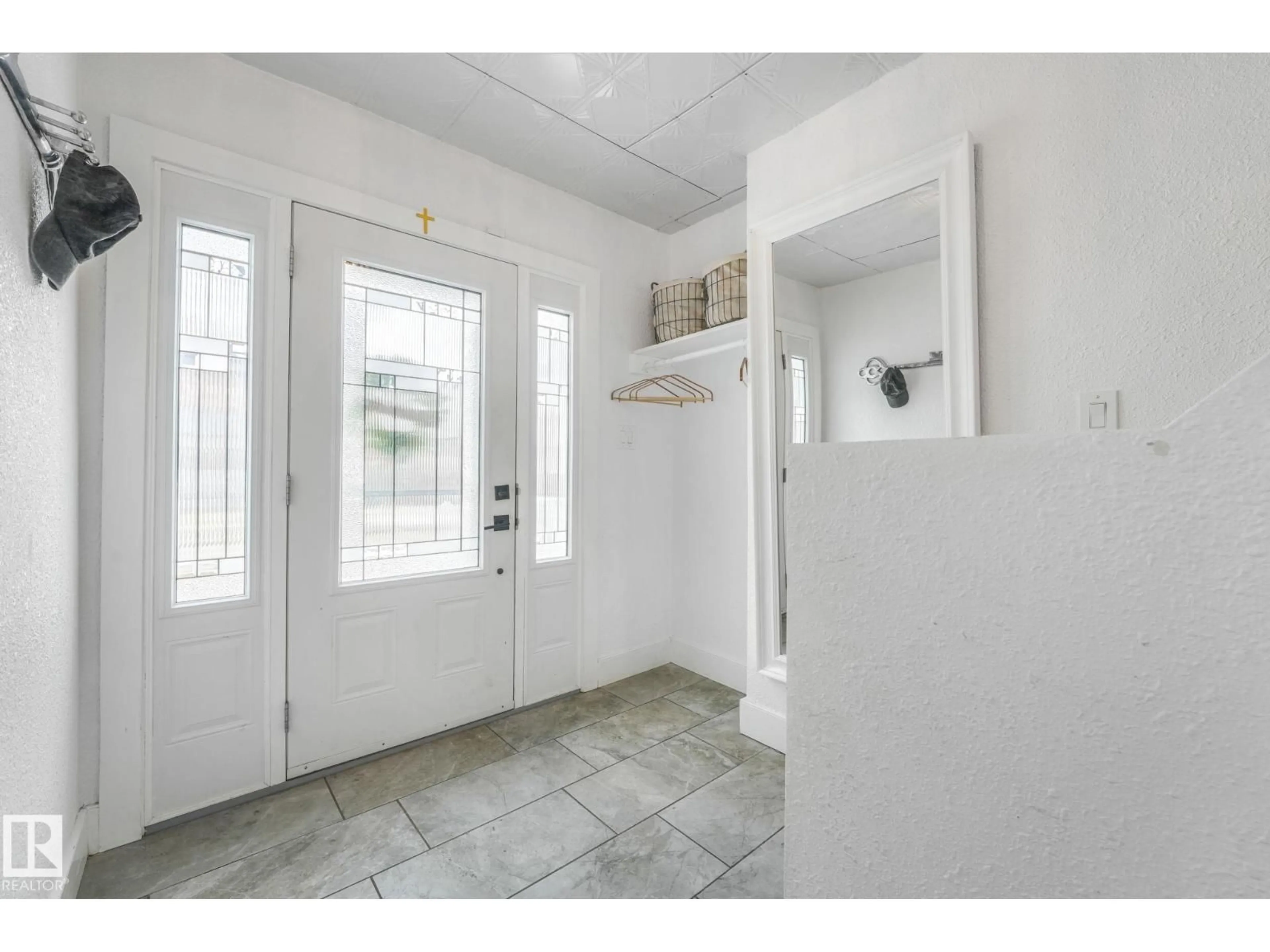 Indoor entryway for 12729 108 AV, Edmonton Alberta T5M2B8