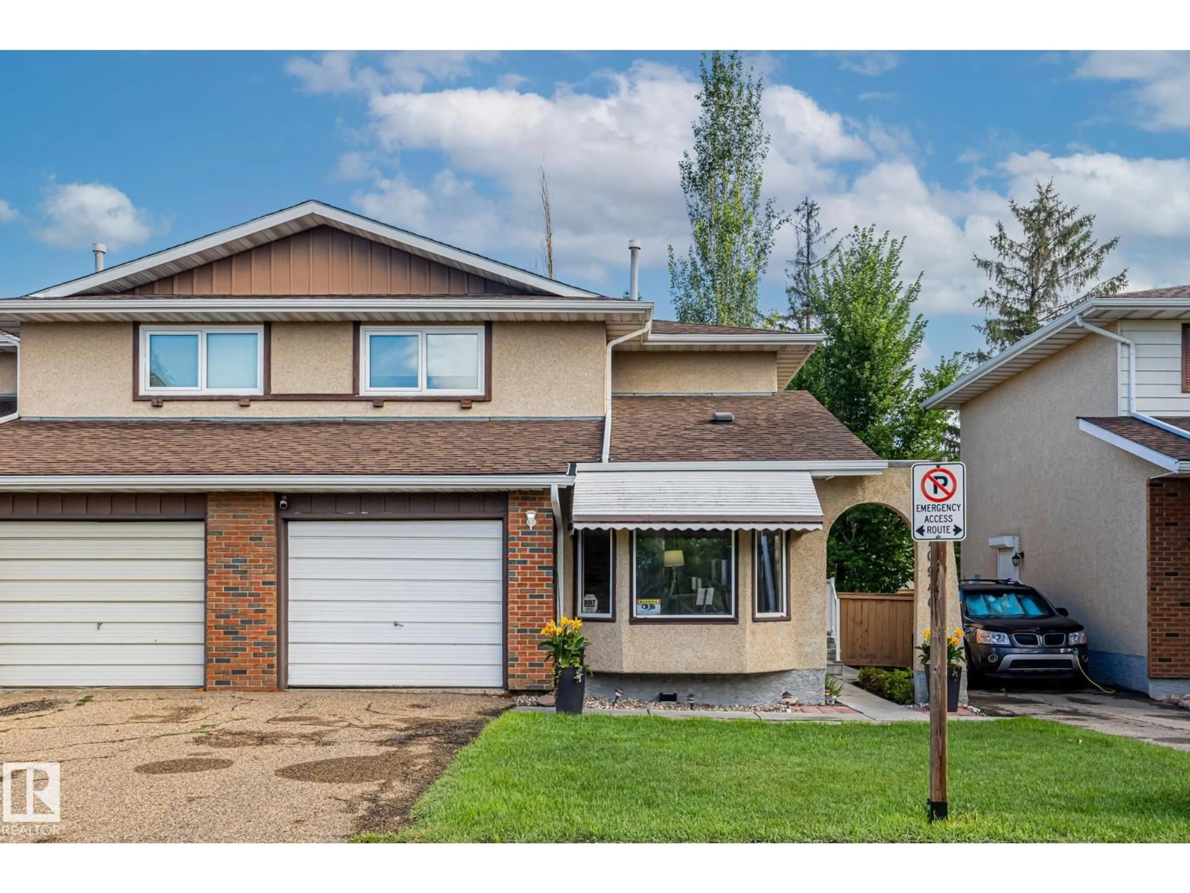 Home with vinyl exterior material, street for 10940 BEAUMARIS RD, Edmonton Alberta T5X1X6