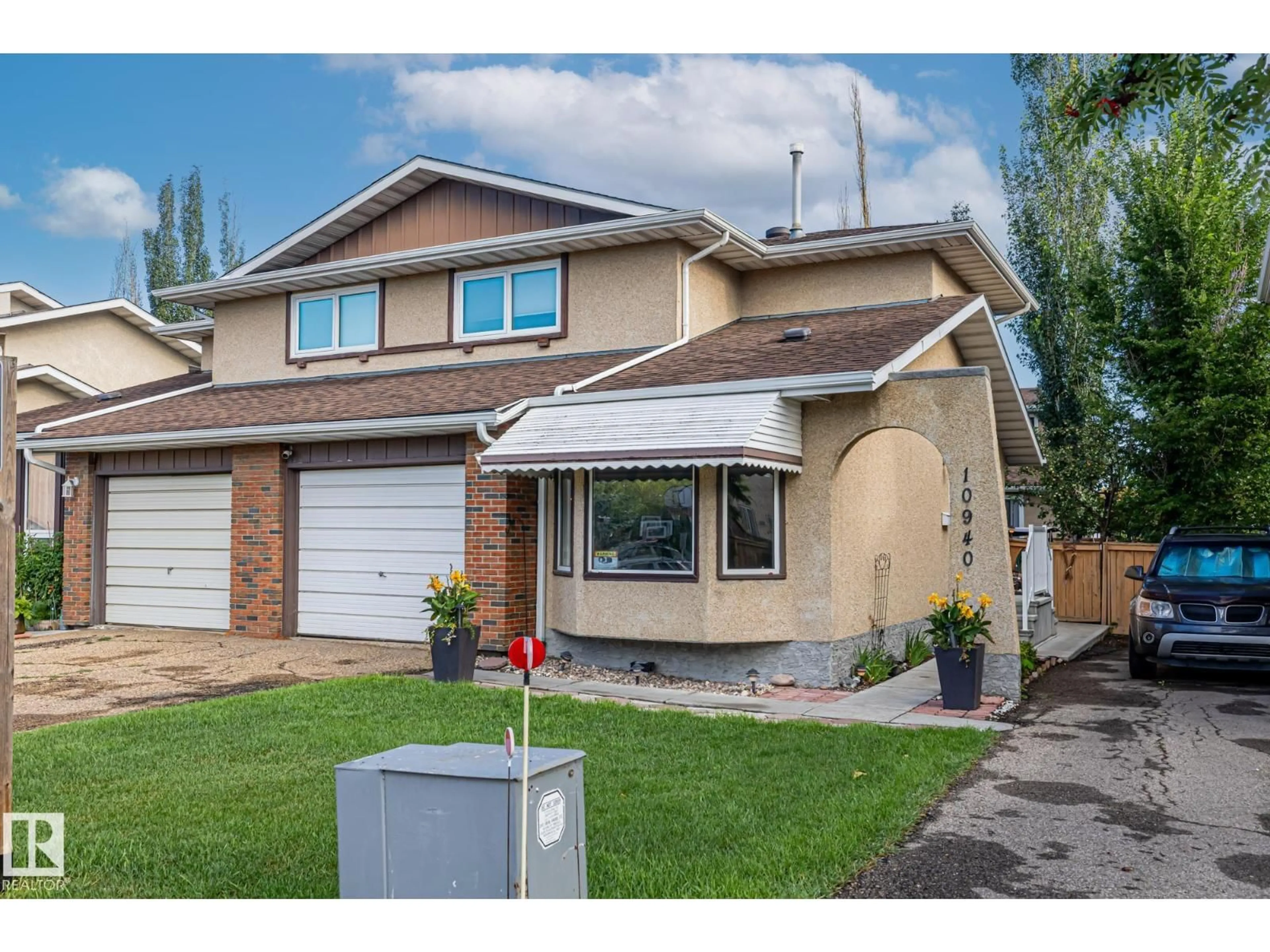 Home with vinyl exterior material, street for 10940 BEAUMARIS RD, Edmonton Alberta T5X1X6