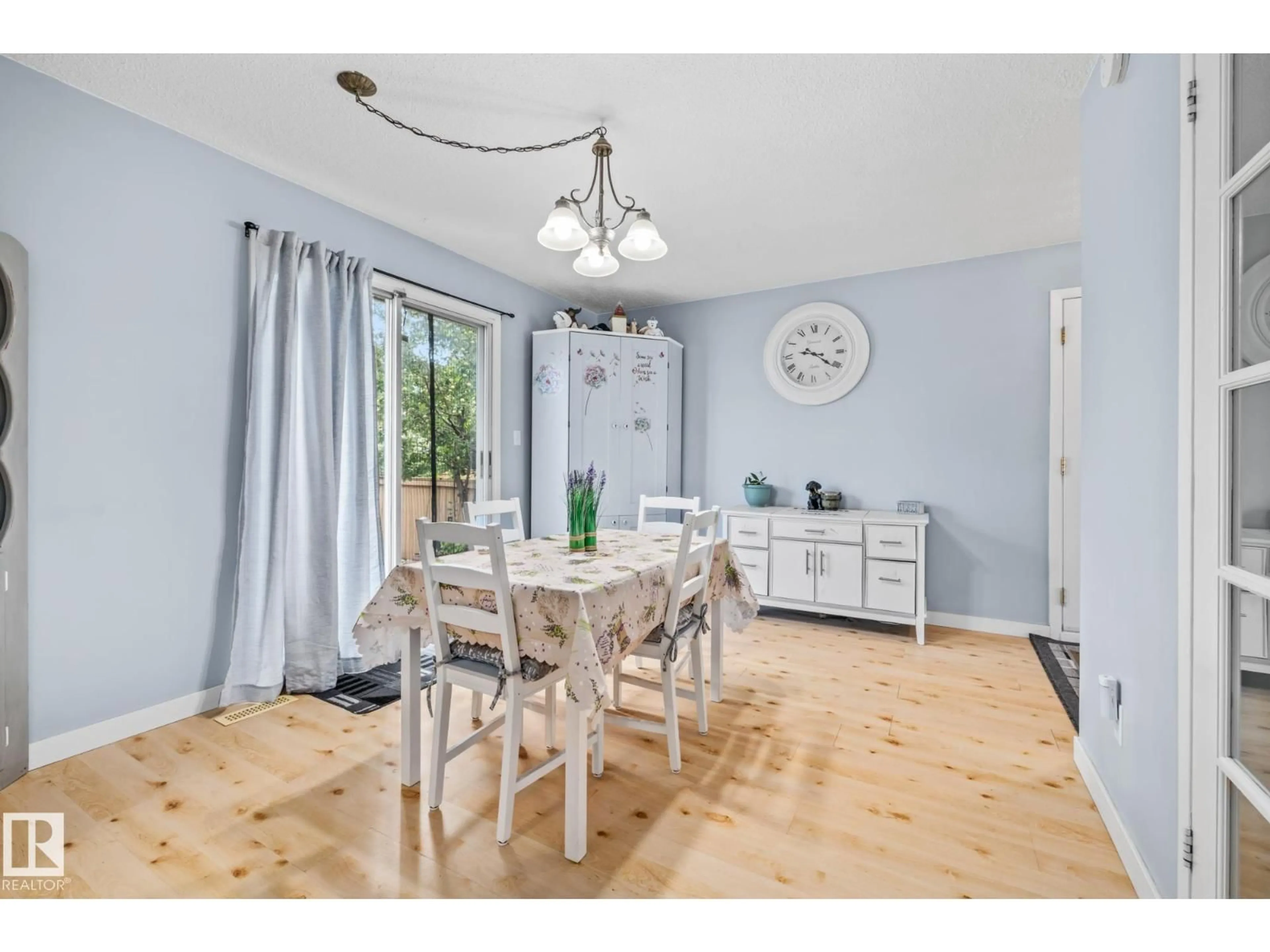 Dining room, wood/laminate floor for 10940 BEAUMARIS RD, Edmonton Alberta T5X1X6