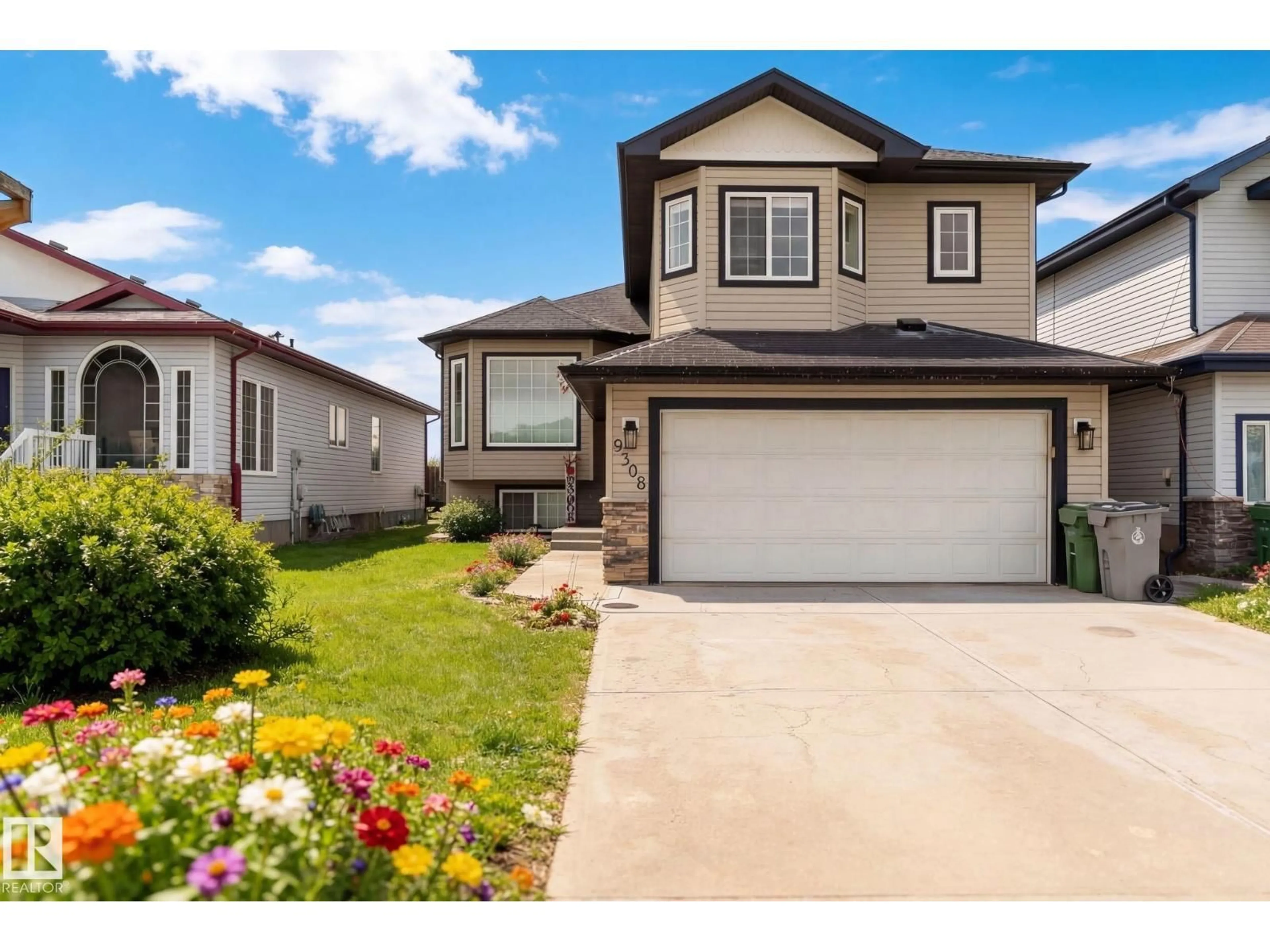 Home with vinyl exterior material, street for 9308 106, Morinville Alberta T8R1C7