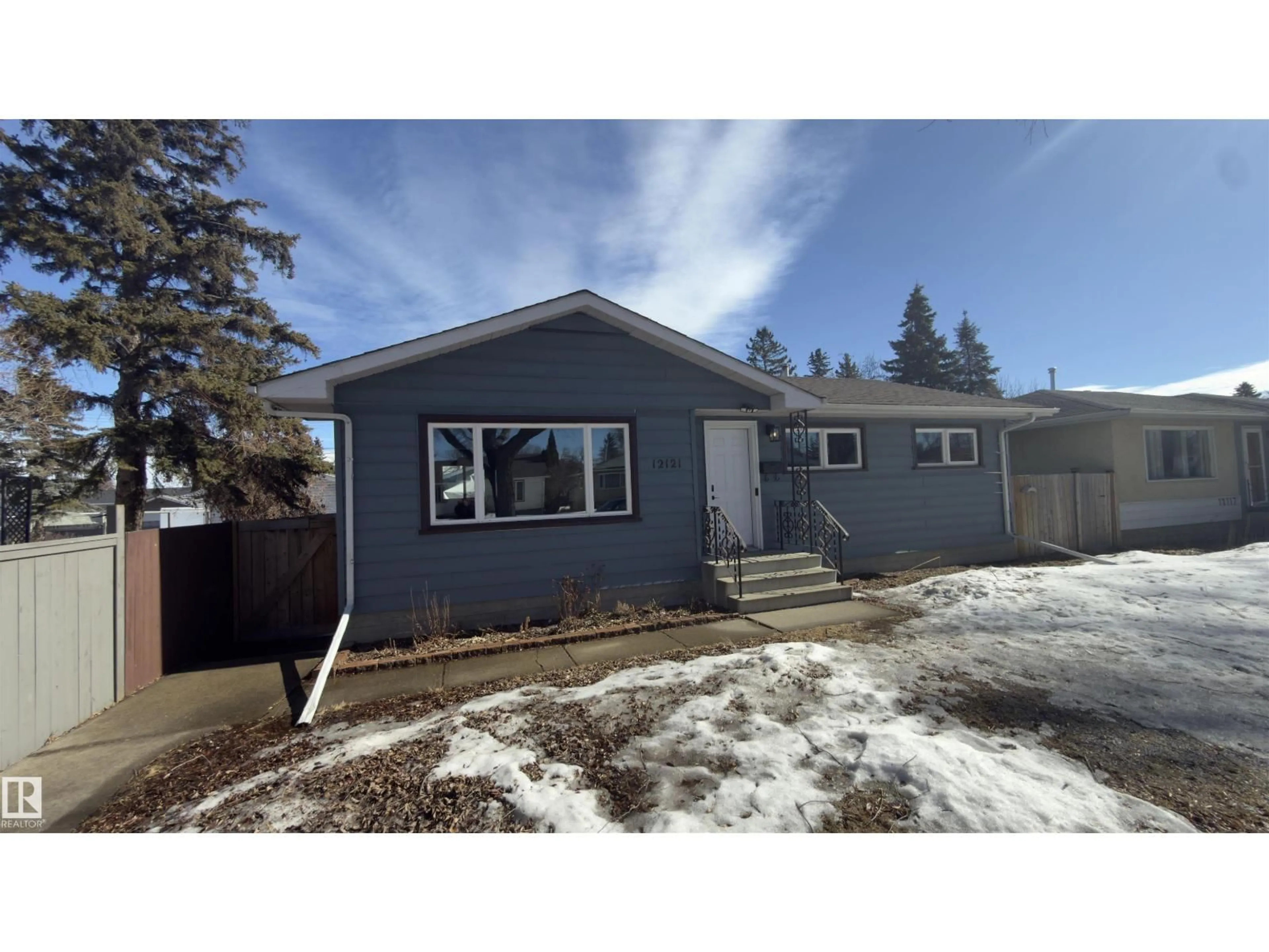 Home with vinyl exterior material, street for NW - 12121 38 ST, Edmonton Alberta T5W2H9