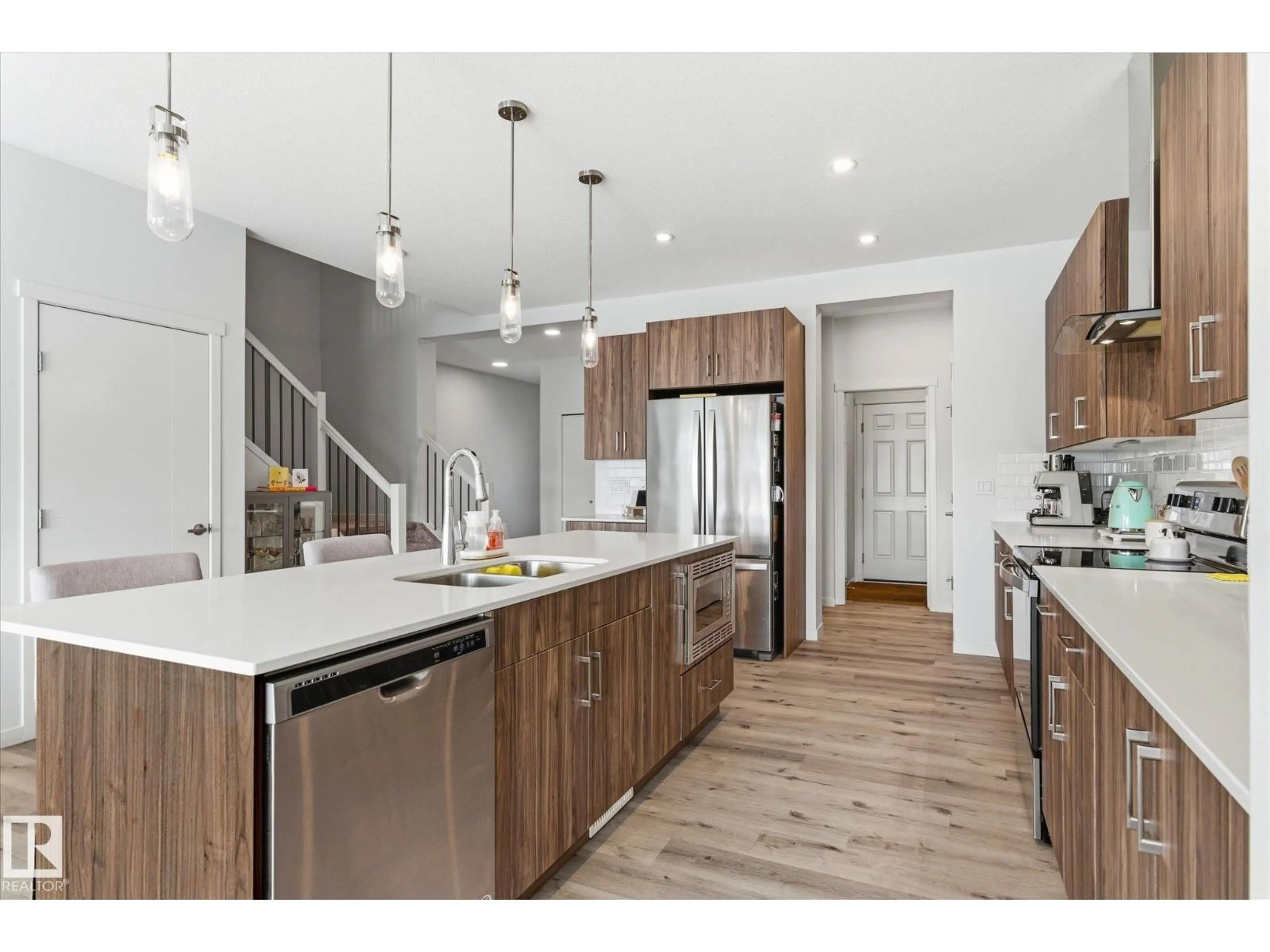 Open concept kitchen, wood/laminate floor for 20031 26 AV, Edmonton Alberta T6M1K3