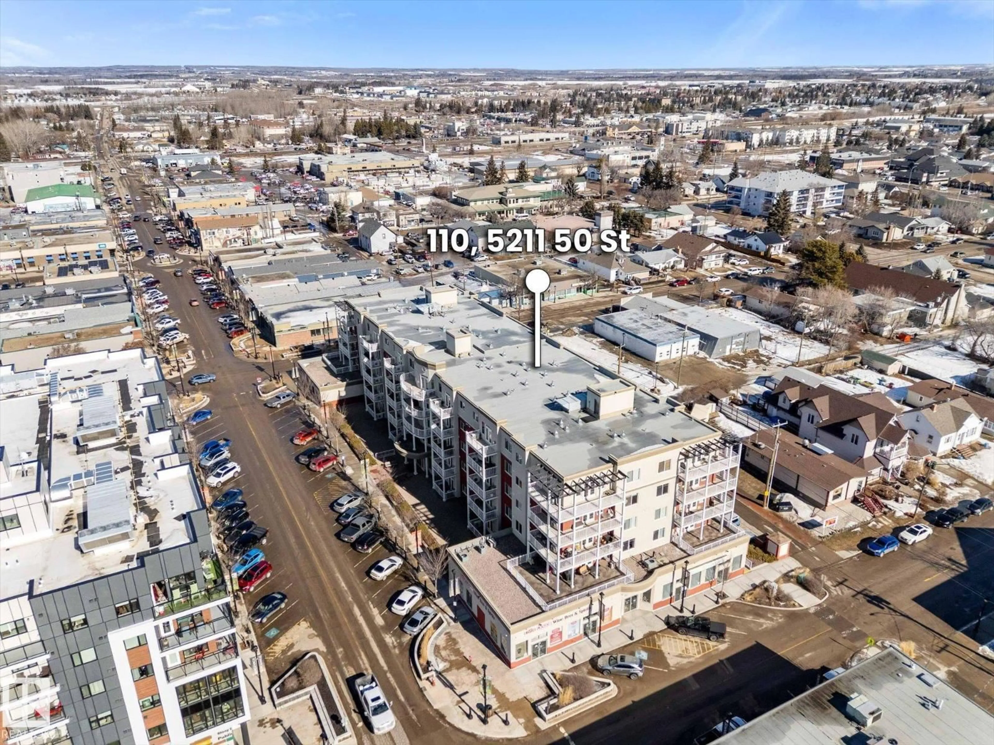 A pic from outside/outdoor area/front of a property/back of a property/a pic from drone, unknown for 110 5211 50 ST, Stony Plain Alberta T7Z0C1