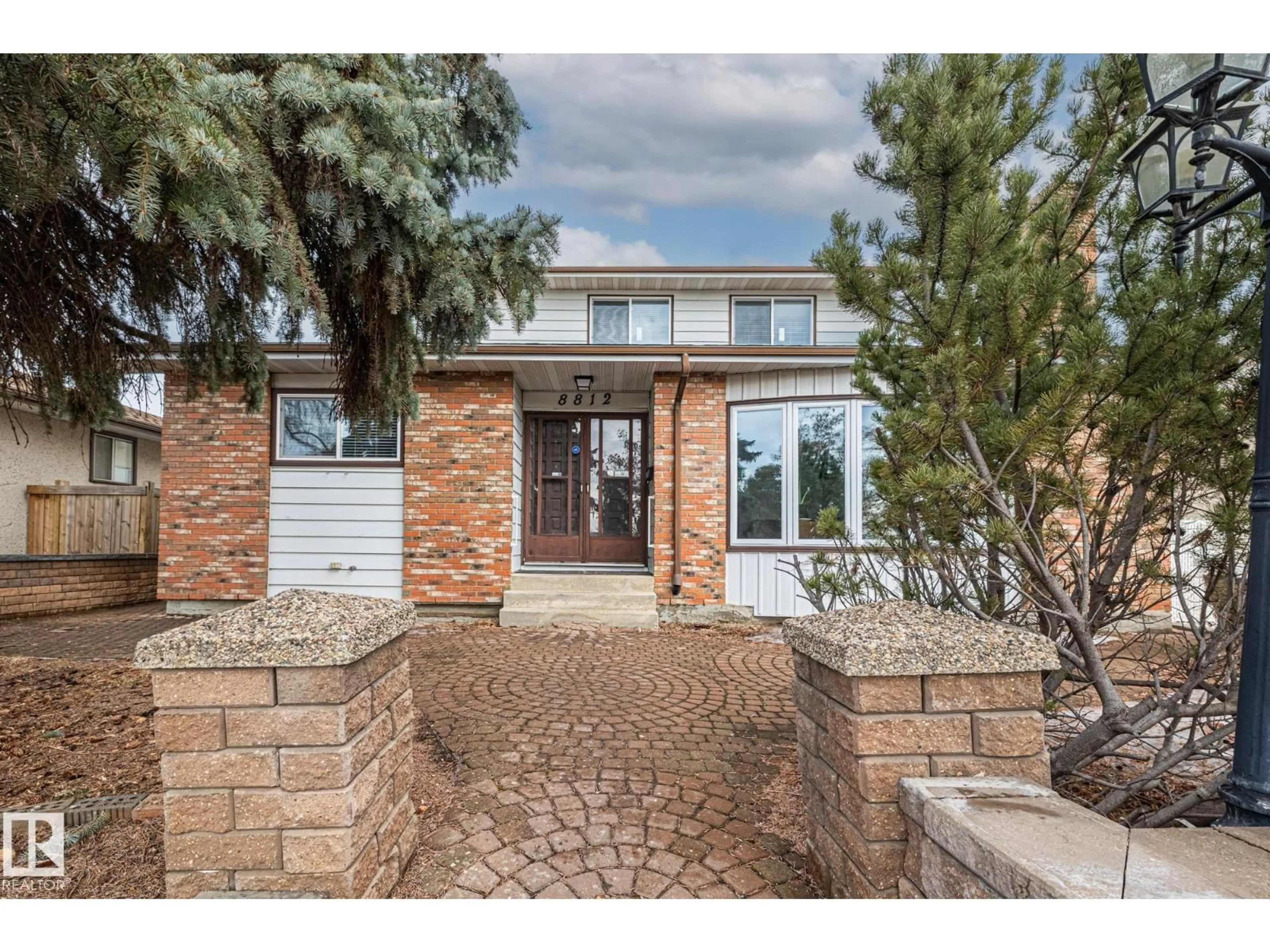 Home with brick exterior material, street for 8812 135 AV, Edmonton Alberta T5E1N3
