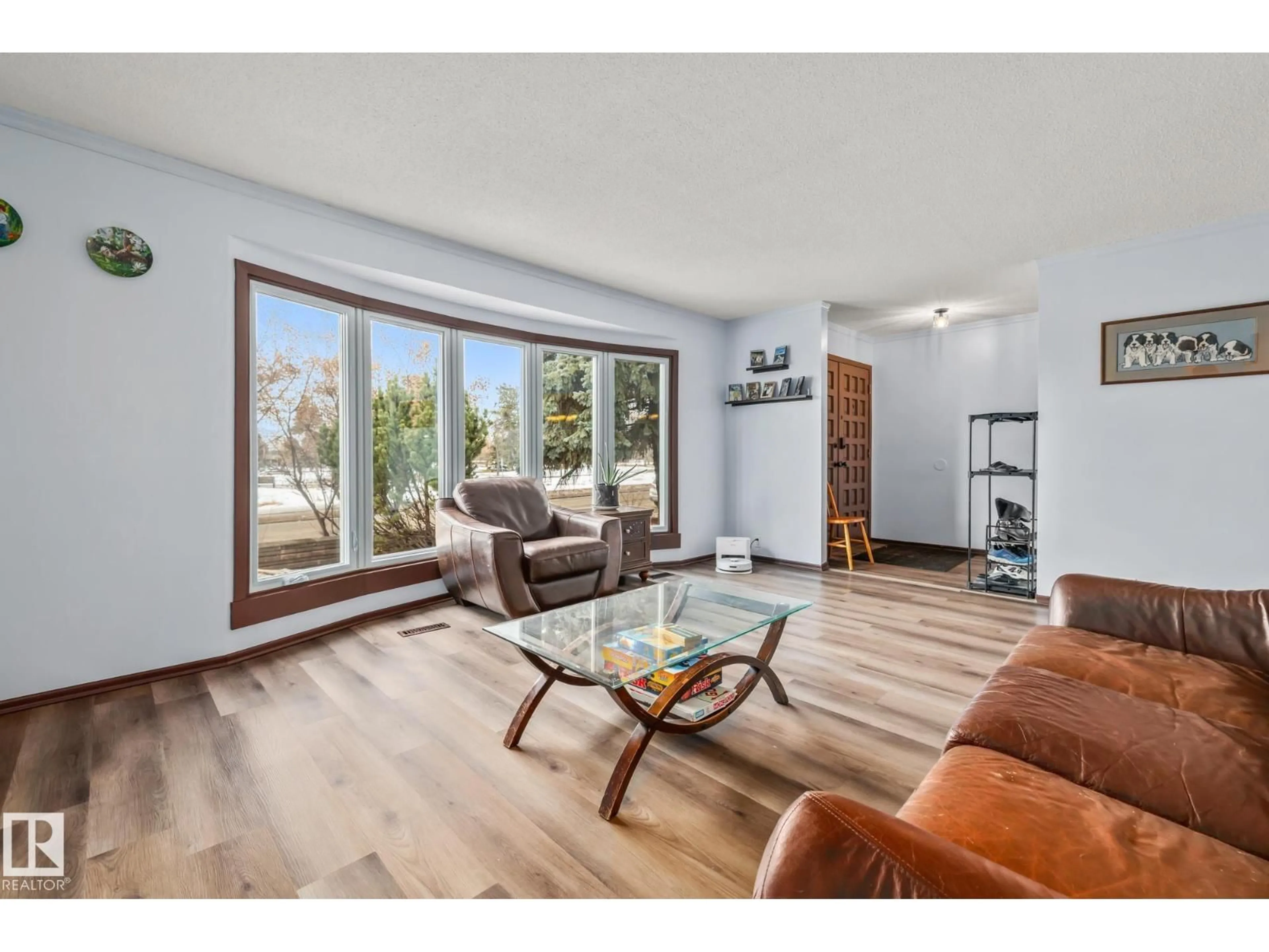 Living room with furniture, wood/laminate floor for 8812 135 AV, Edmonton Alberta T5E1N3