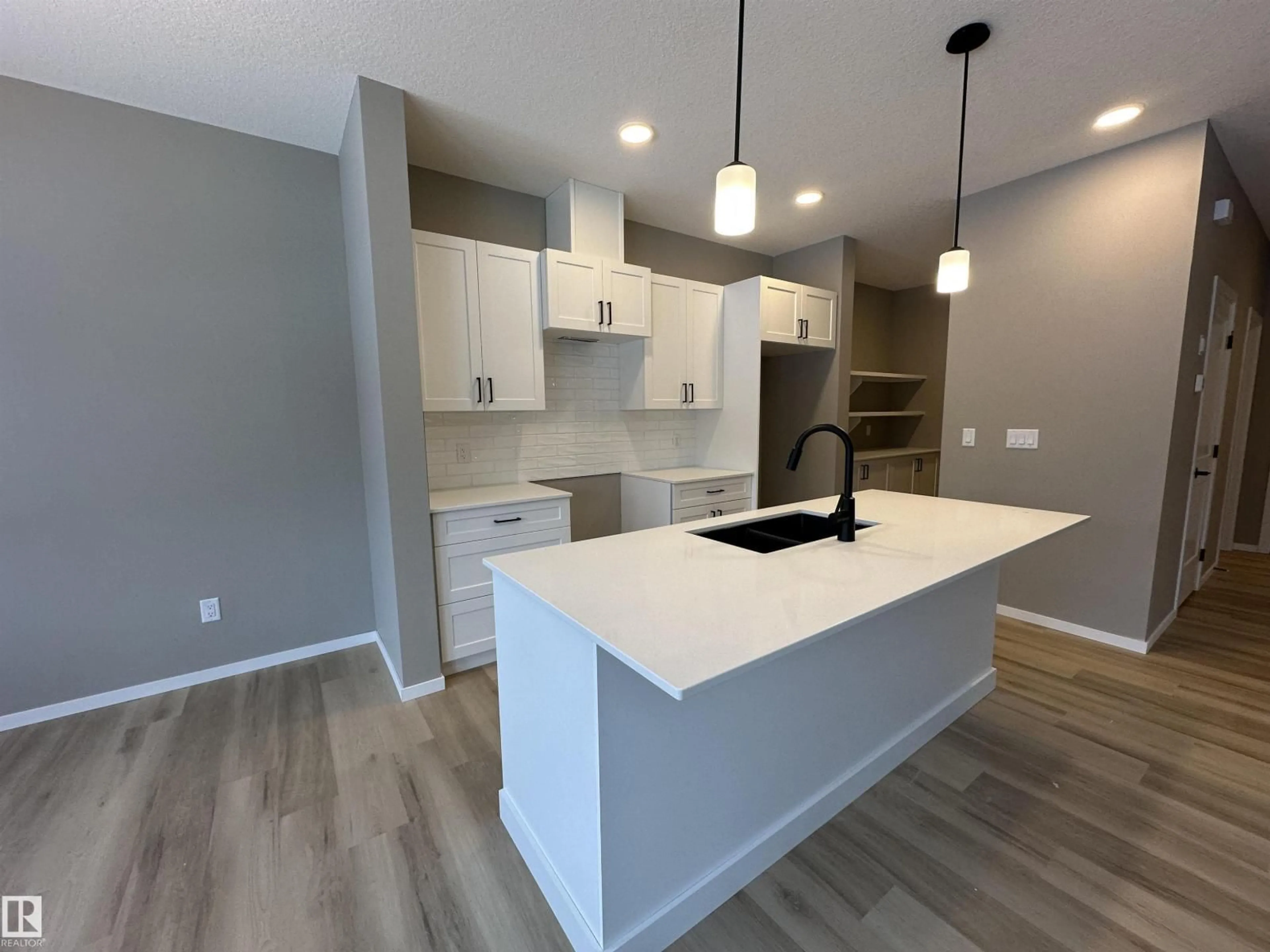 Open concept kitchen, wood/laminate floor for 1154 SOUTH CREEK WD, Stony Plain Alberta T7Z0M1