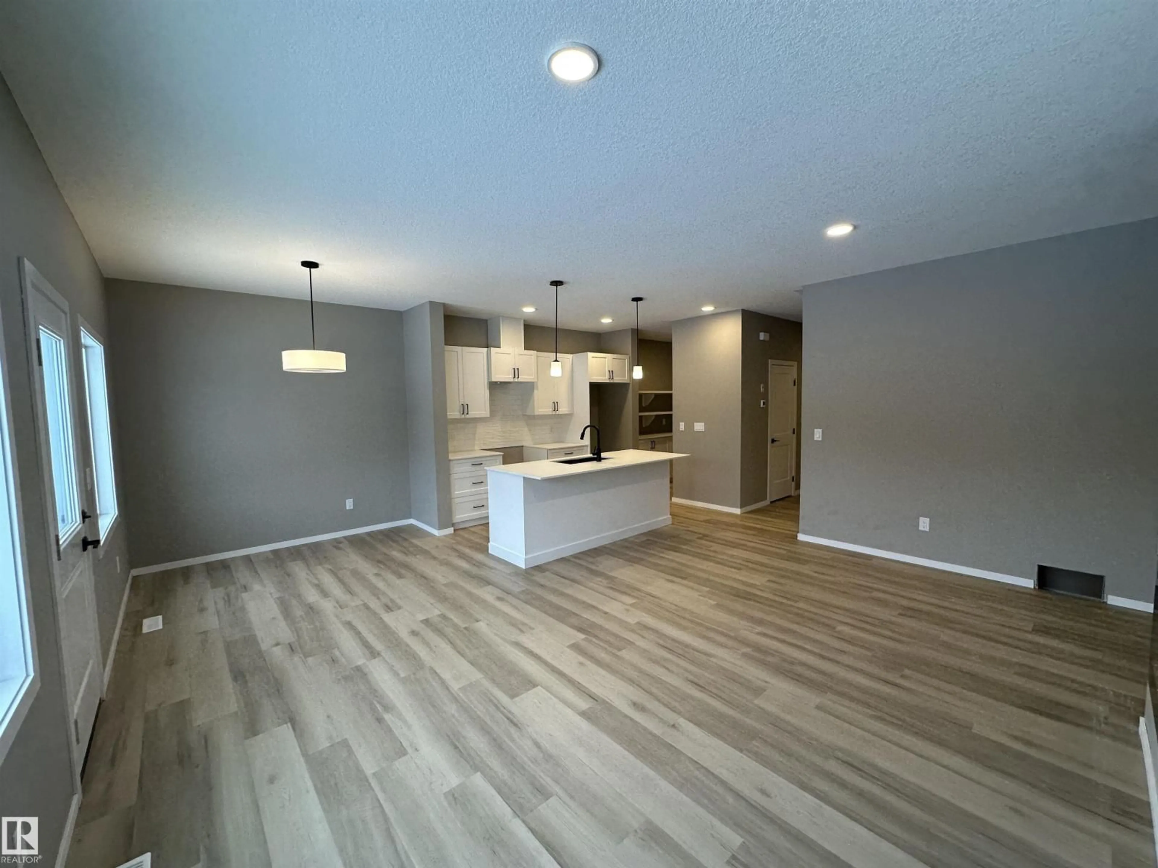 Open concept kitchen, wood/laminate floor for 1154 SOUTH CREEK WD, Stony Plain Alberta T7Z0M1