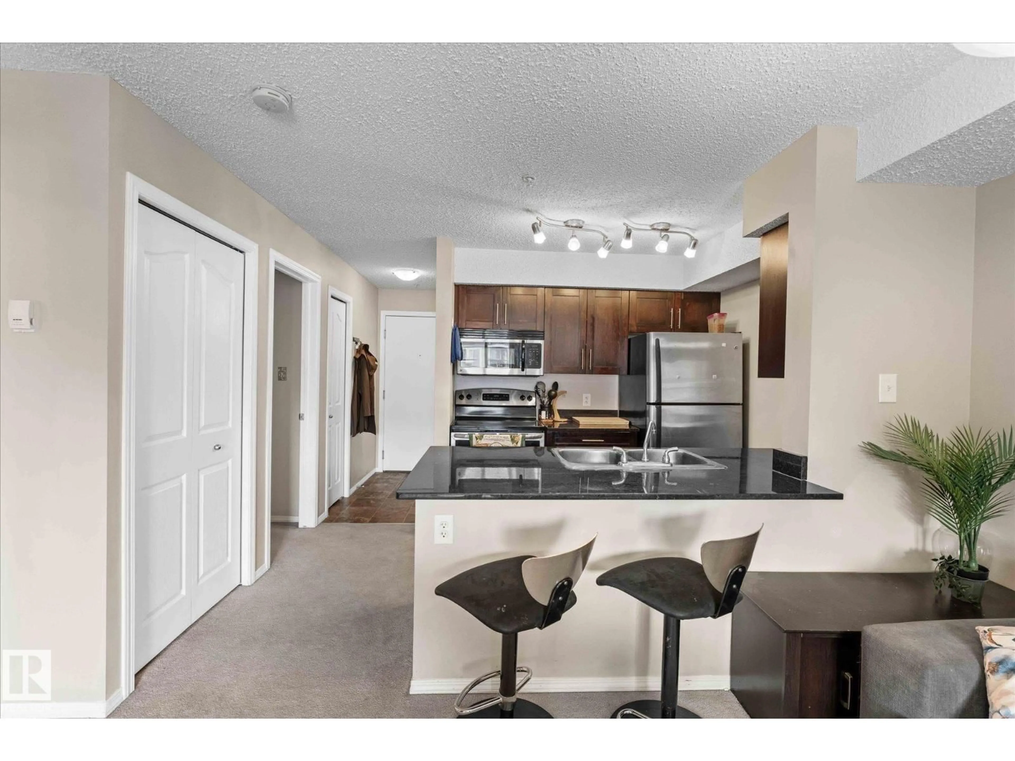 Open concept kitchen, unknown for #309 - 1080 MCCONACHIE BV, Edmonton Alberta T5Y0X2