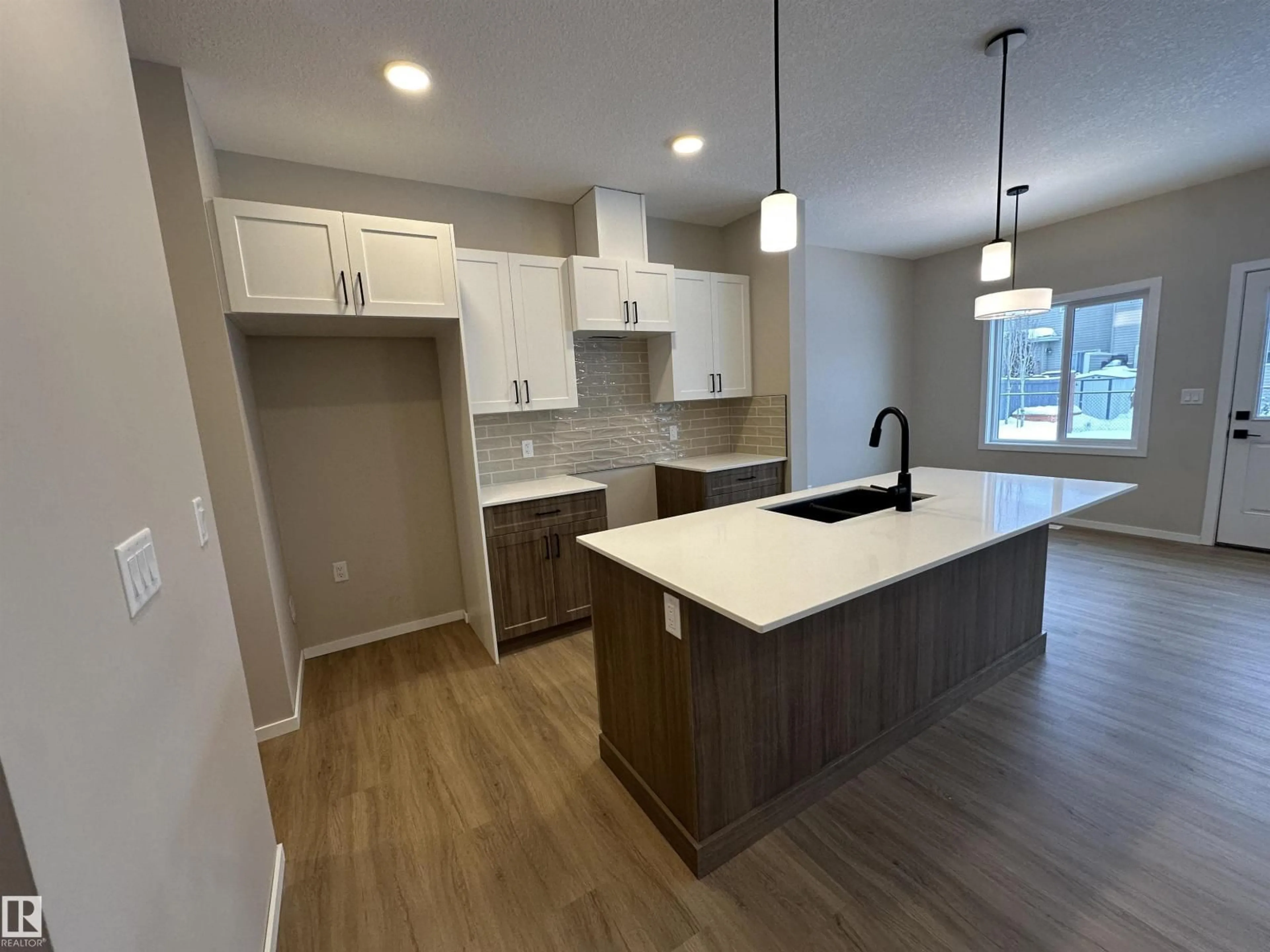 Open concept kitchen, wood/laminate floor for 1152 SOUTH CREEK WD, Stony Plain Alberta T7Z0M1